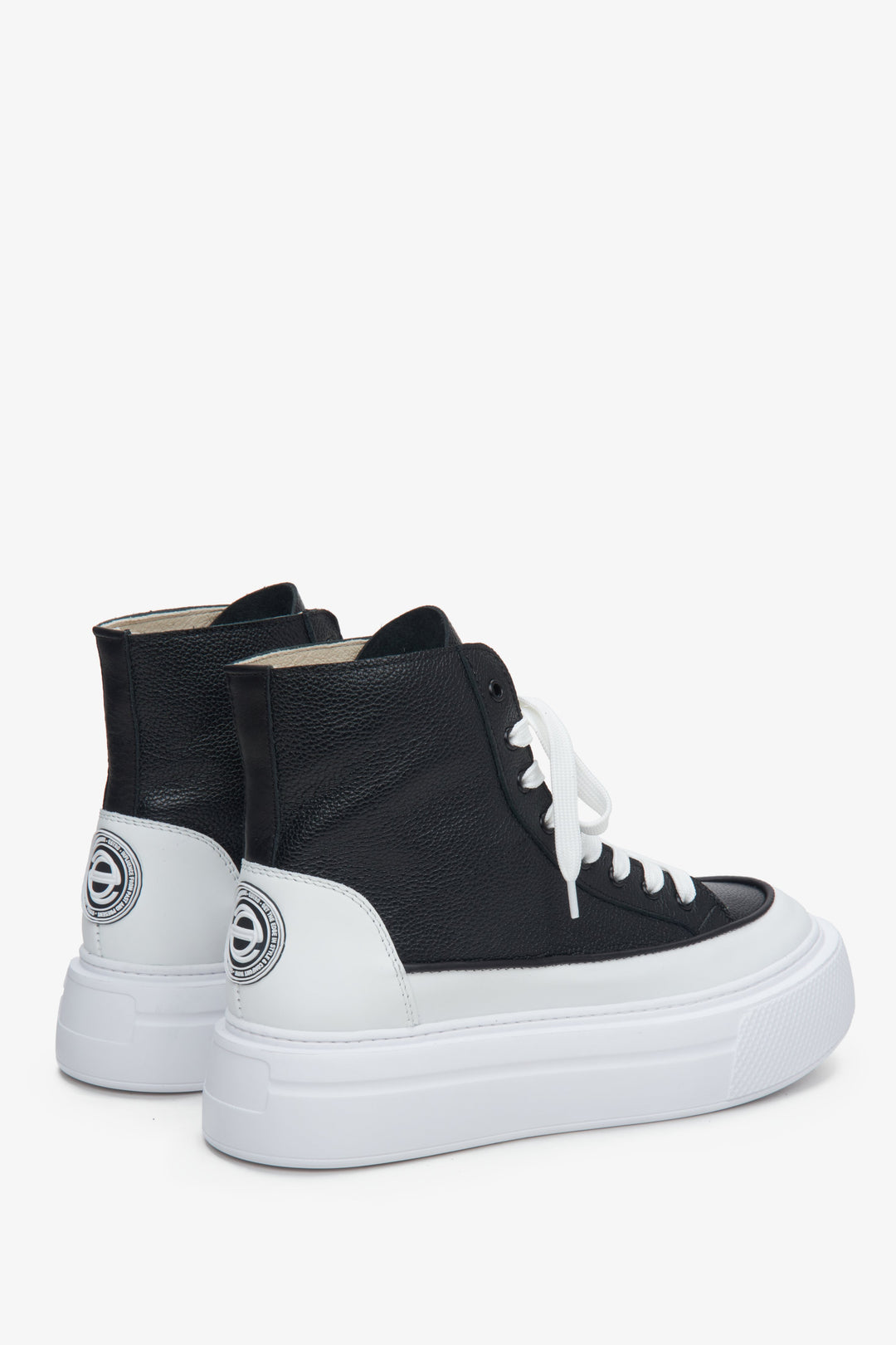 High-top Women's sneakers made of Italian genuine leather in black and white - close-up of the side vamp and heel.