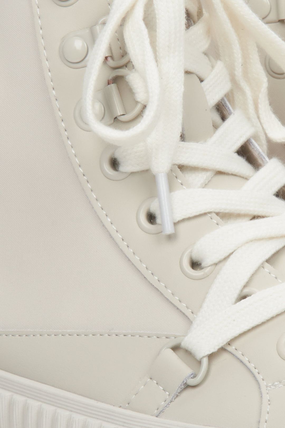 Women's white leather sneakers by Estro - close-up on details.