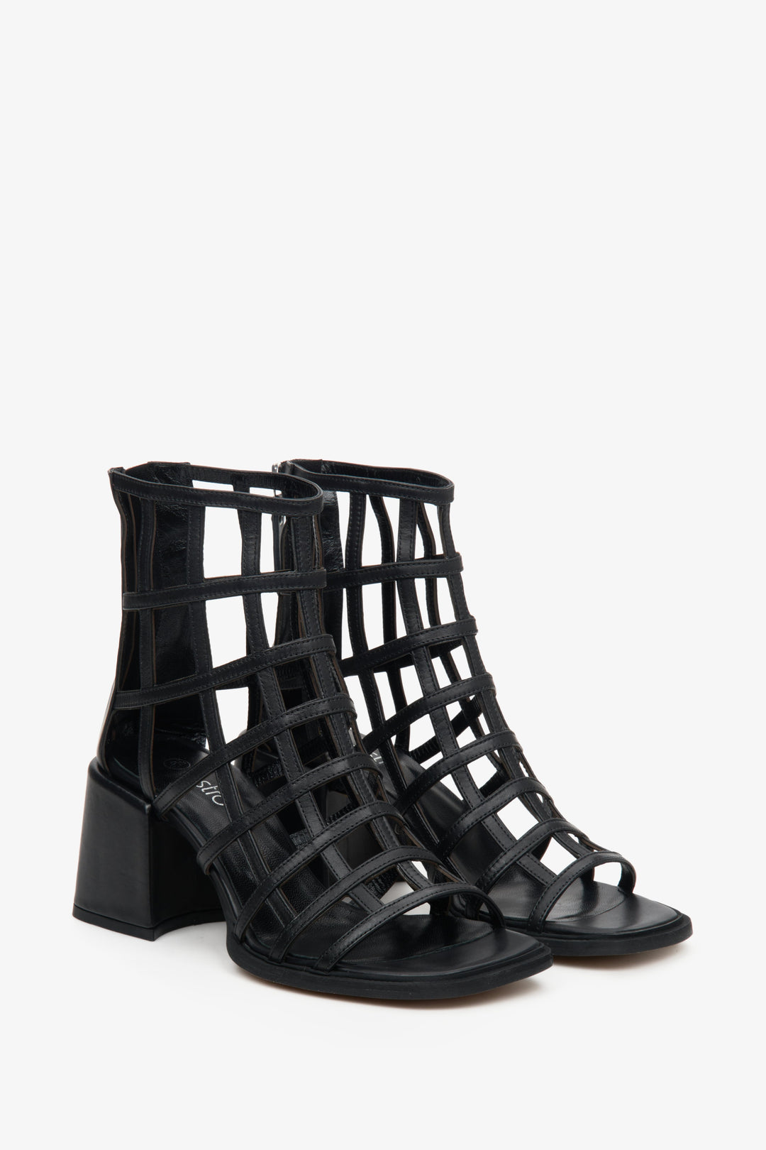Estro's black block heel sandals made of crossed, thin straps.