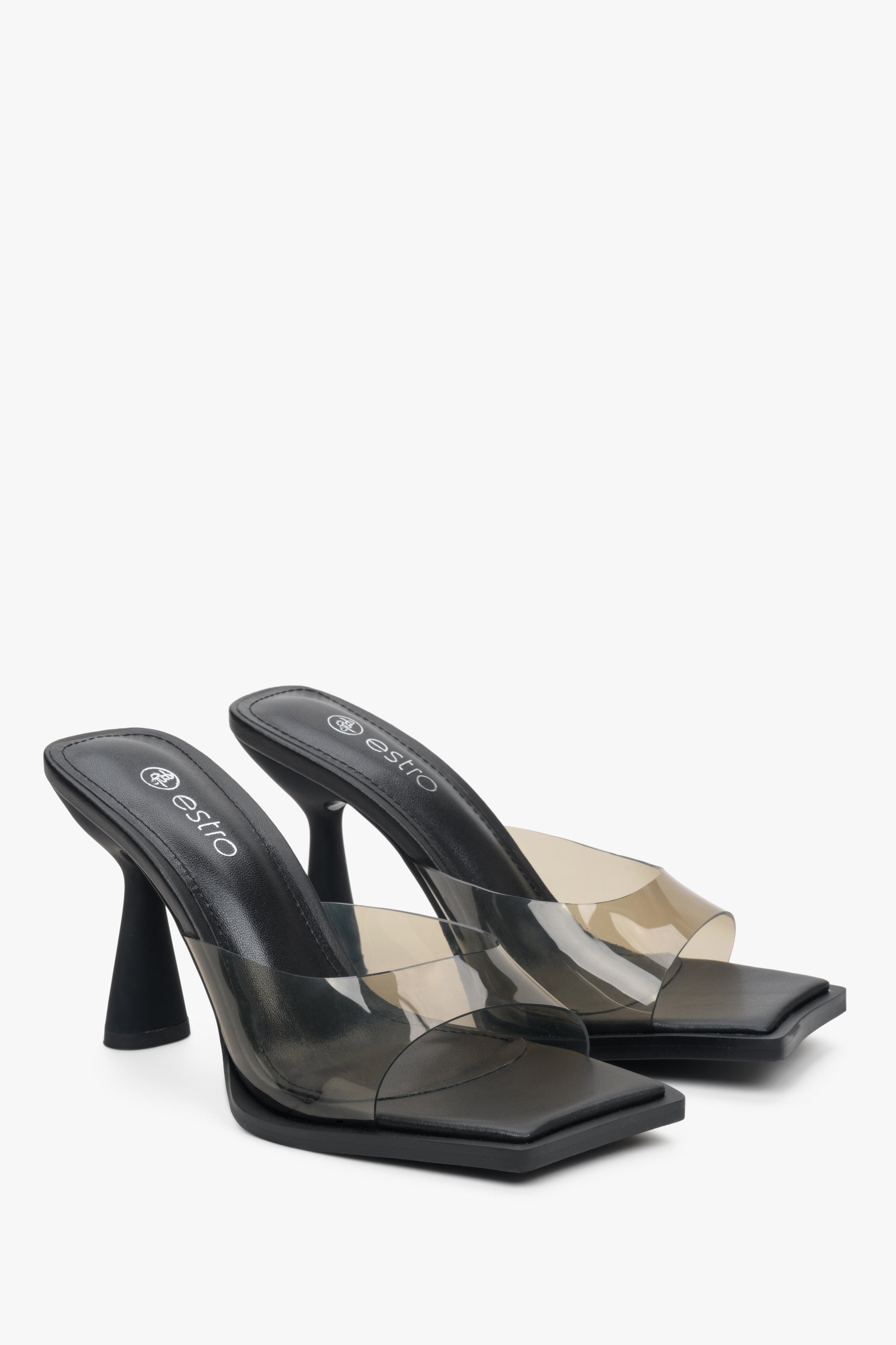 Estro women's high-heeled clear sandals with a black sole.