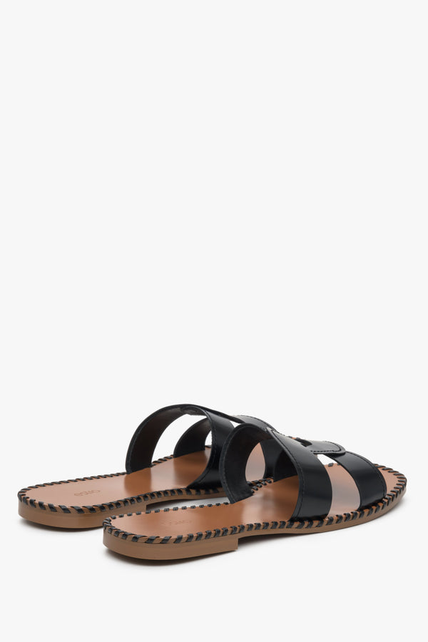 Women's black leather slide sandals.