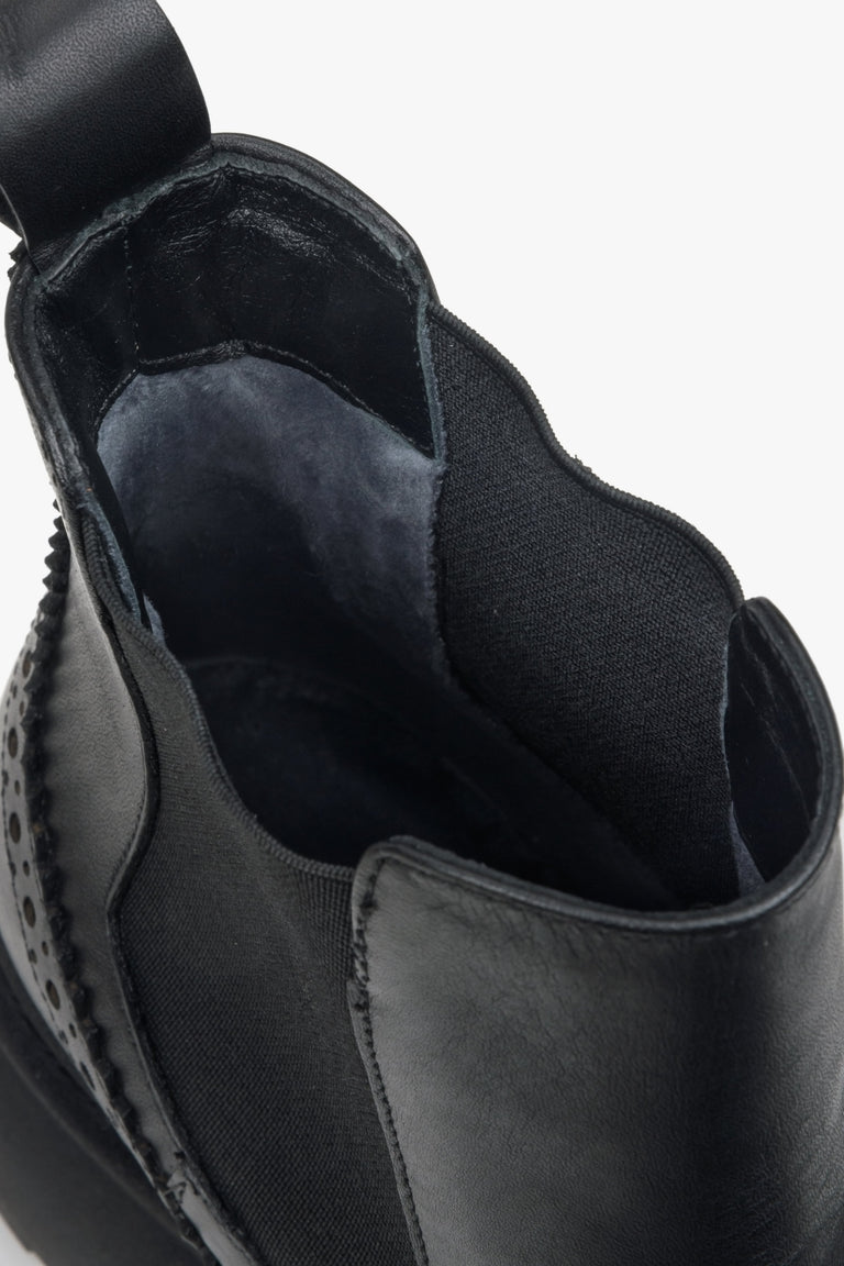 Black leather Chelsea boots - a cloes-up on details.