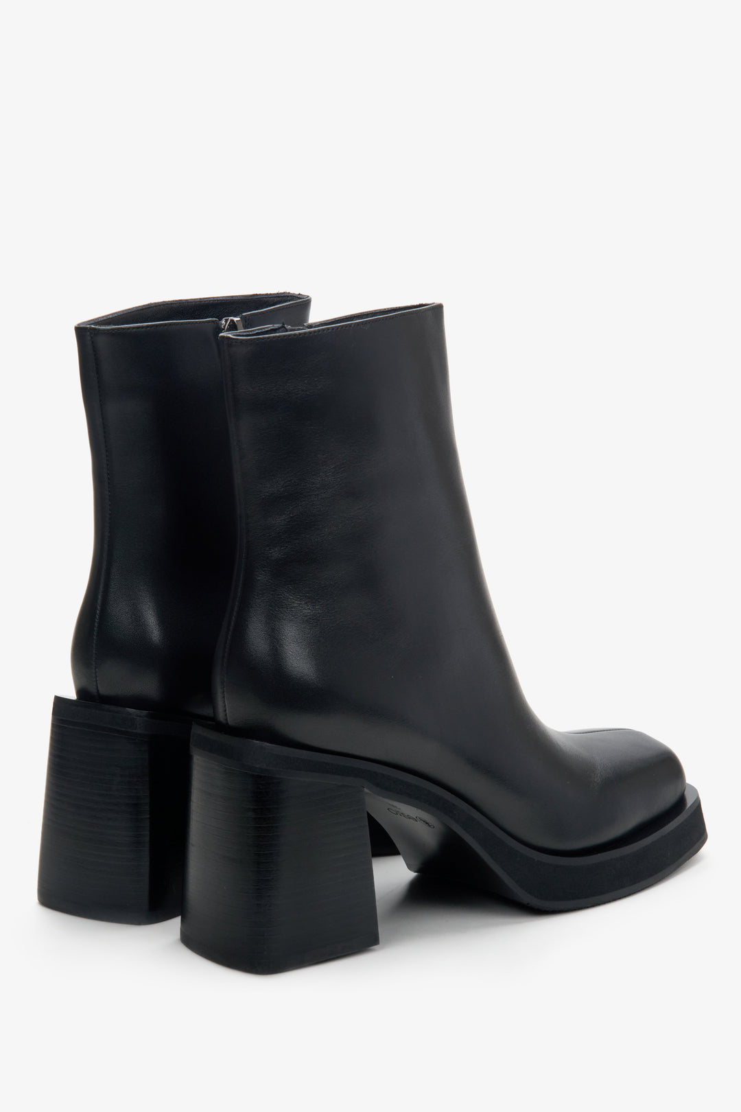 Women's black boots made of genuine leather by Estro - close-up on the heel.