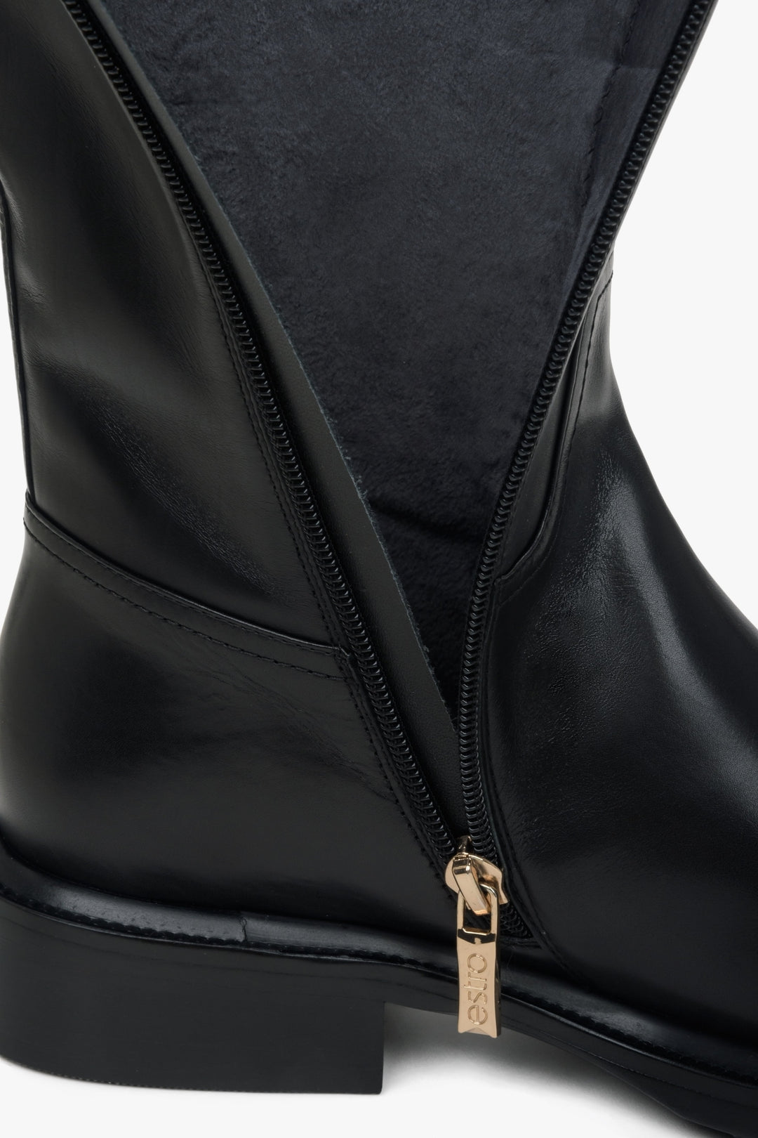 Women's black leather boots - close-up on the details.