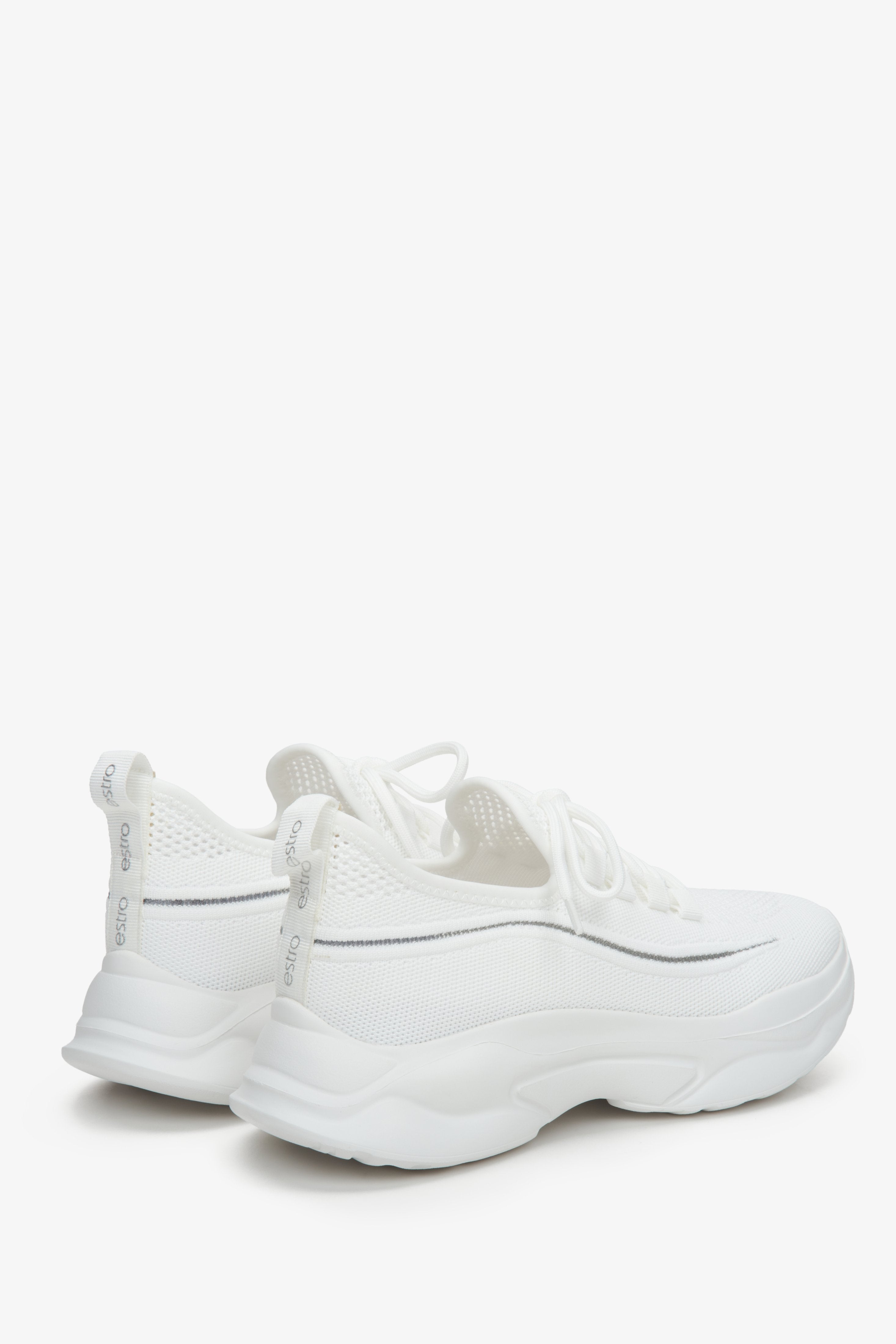 White low-top mesh women's sneakers - a close-up on heel counter.