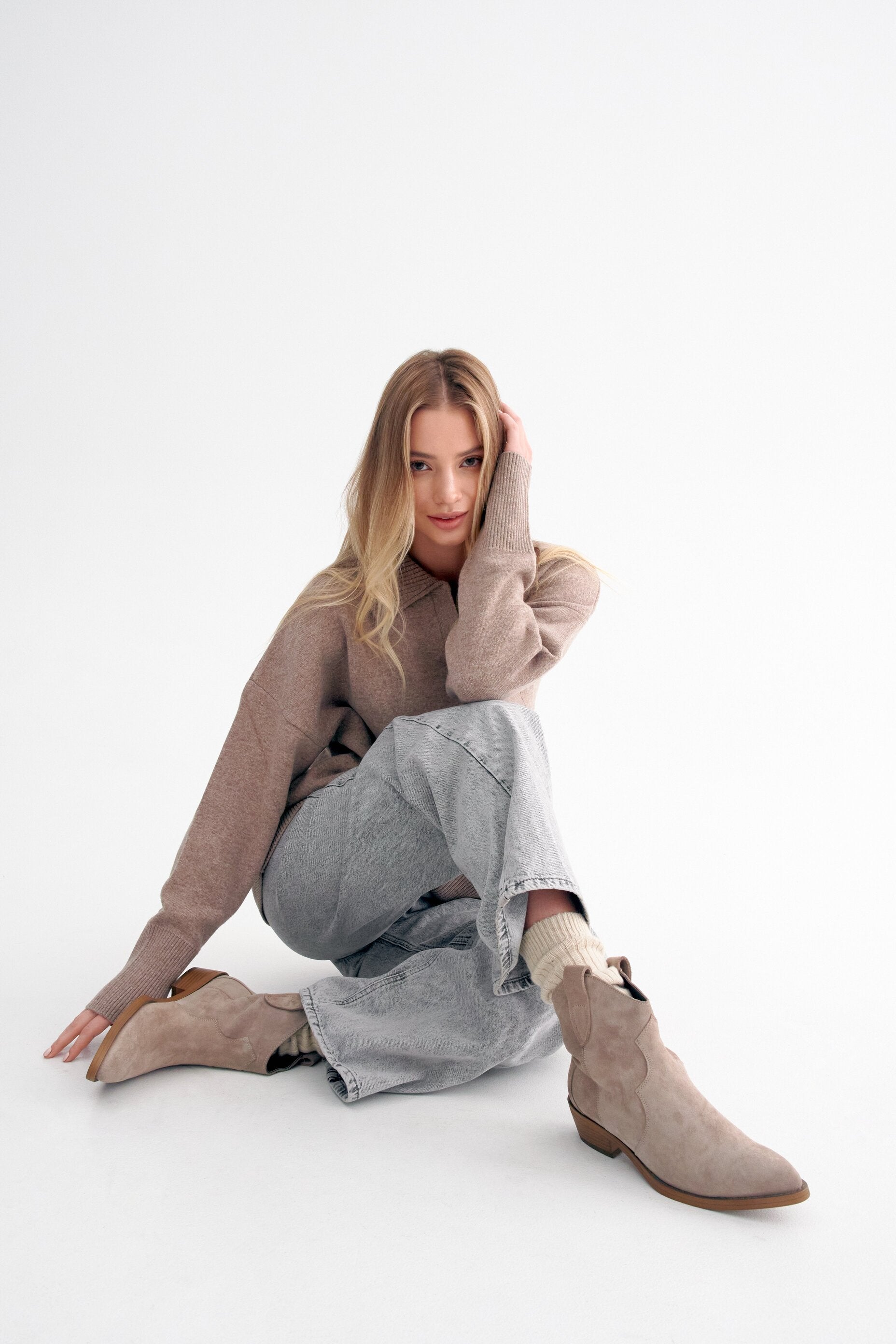 Women's beige cowboy boots in genuine velour by Estro - presentation on a model.