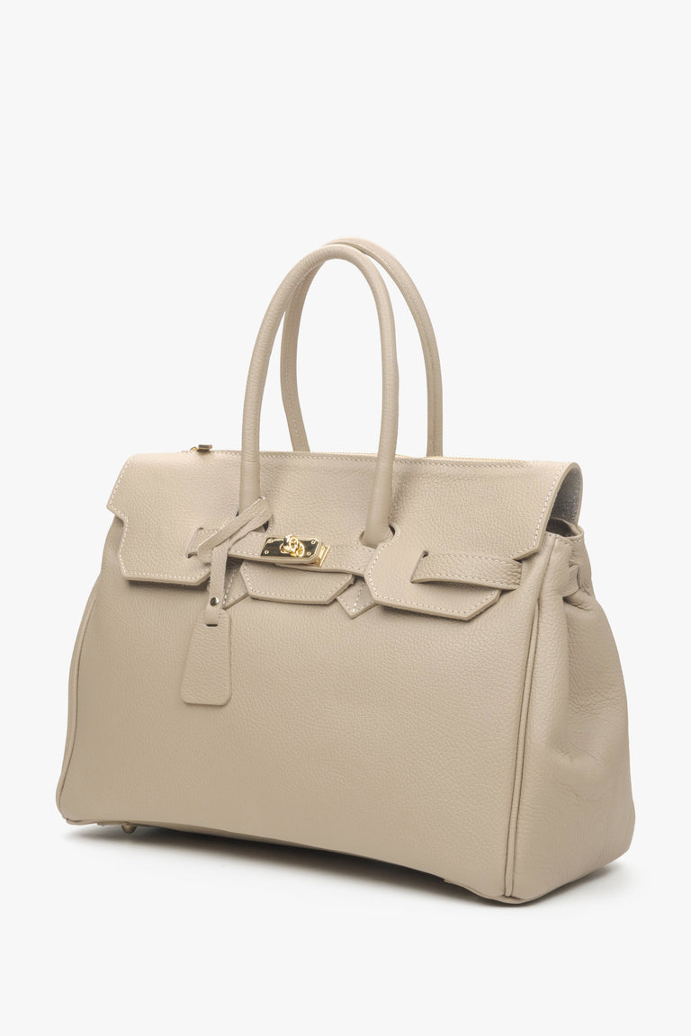 Women's satchel handbag in a delicate beige shade, made of genuine Italian leather, known for its exceptional quality.