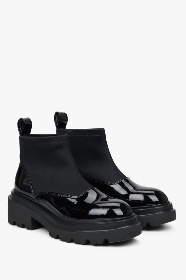 Low women's ankle boots made of black patent genuine leather by Estro - front and side of the shoes. 