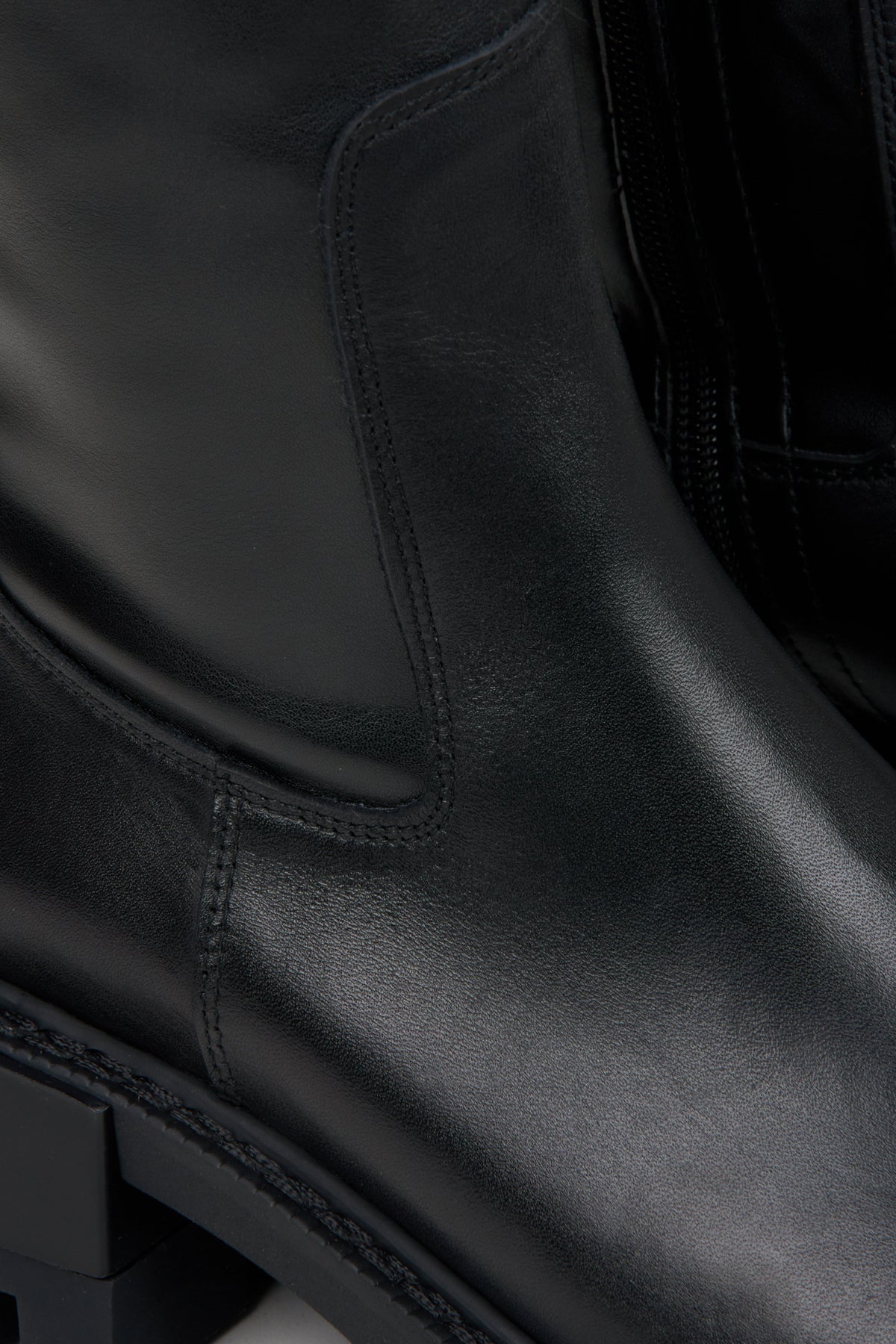 Women's black leather boots by Estro - close-up on details.