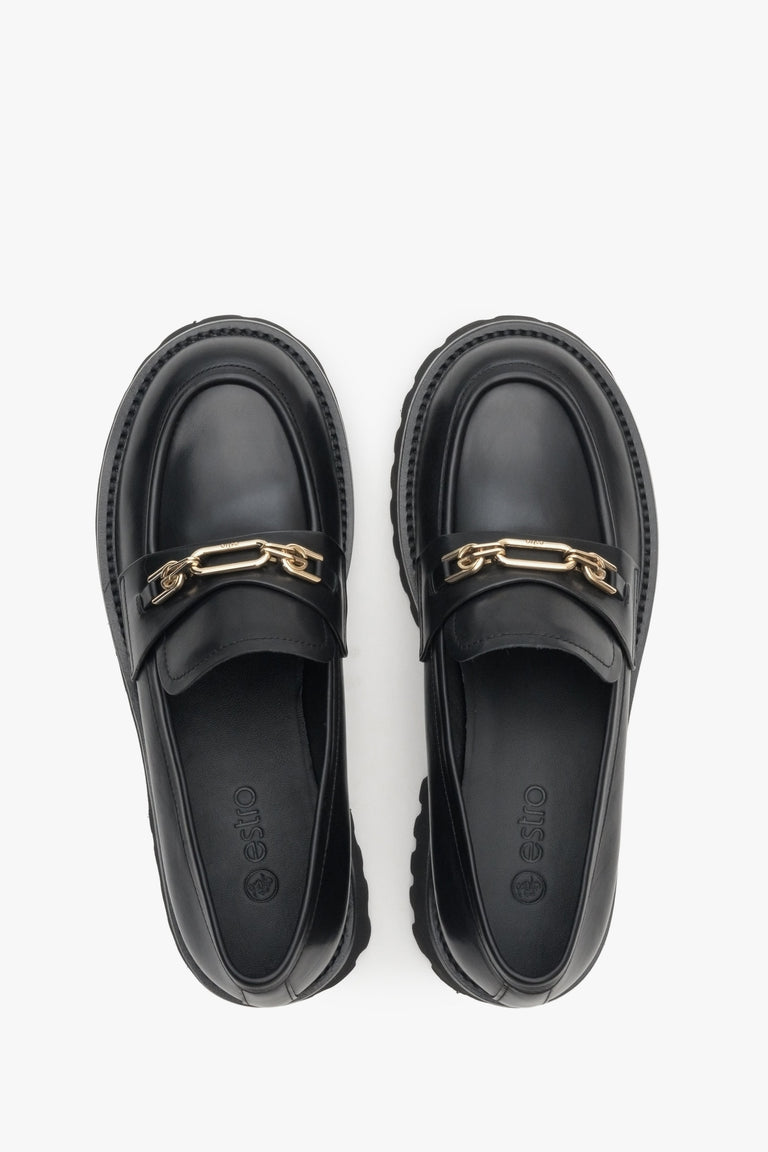 Women's black genuine leather moccasins with a golden buckle by Estro - top view presentation of the model.