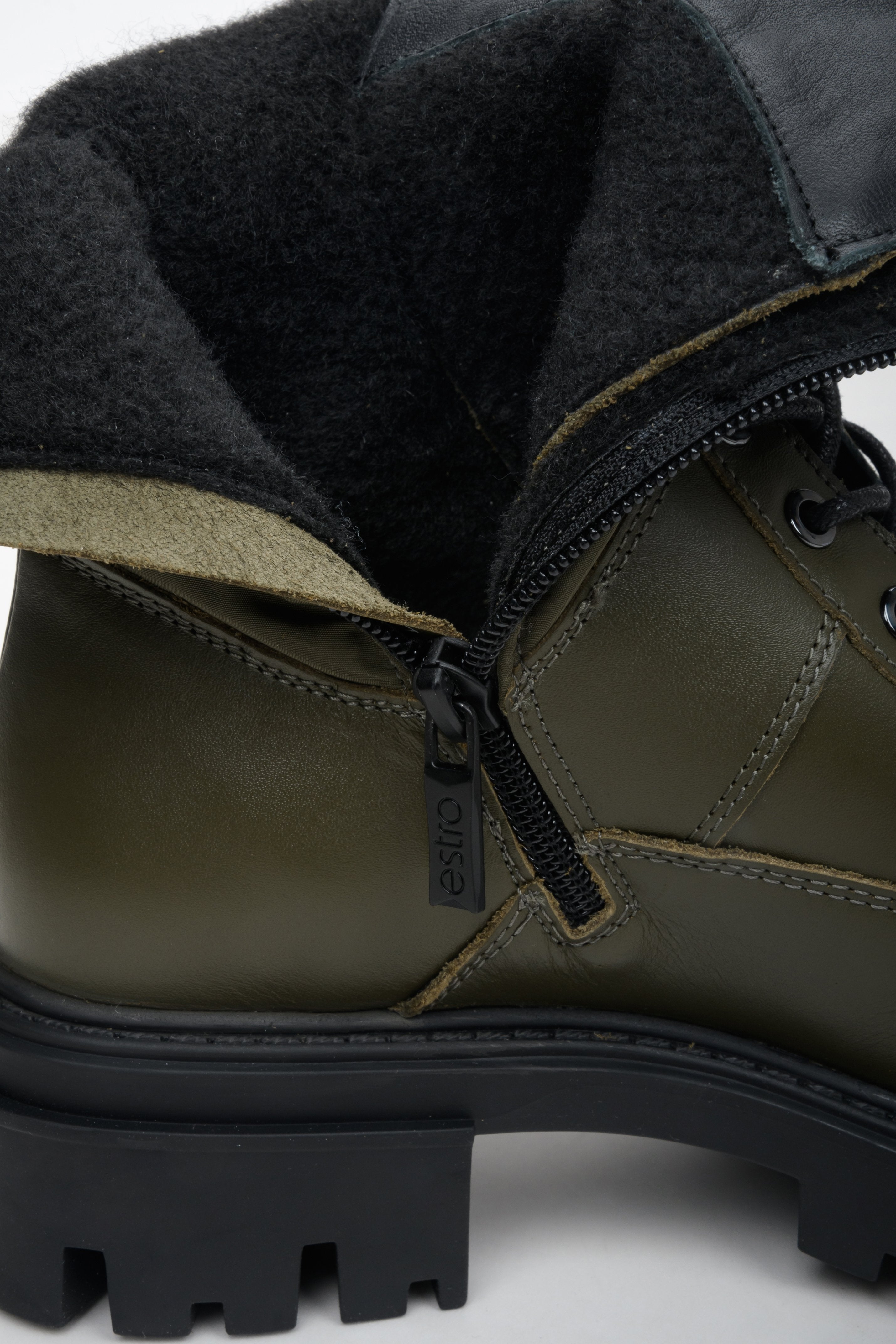 Elegant dark green women's ankle boots genuine leather - close-up of the shoe's interior.