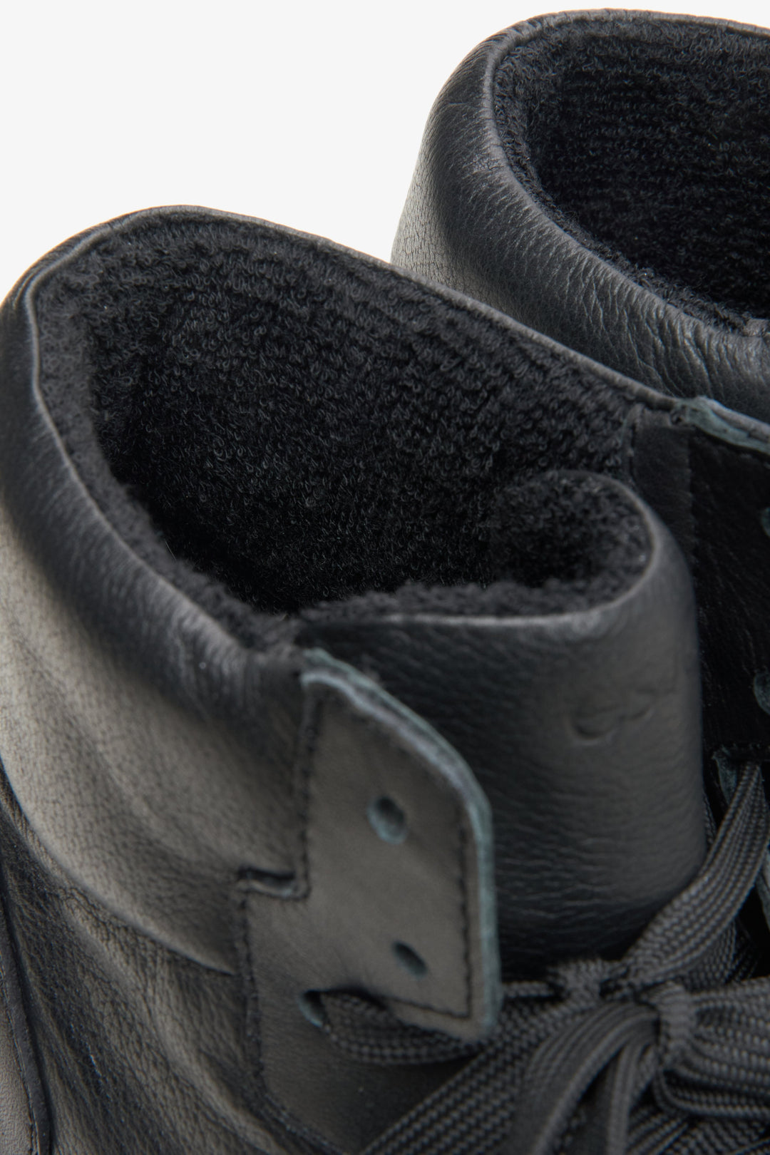 Women's high-top leather sneakers, black color - close-up on details.