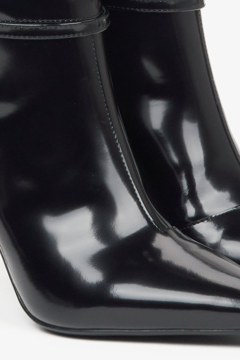 Black knee-high boots Estro with a high heel, made of genuine patent leather - details. 