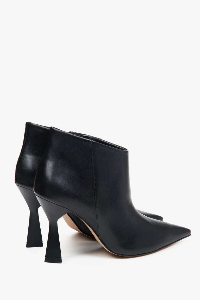 Women's black short leather ankle boots by Estro - close-up of the heel and side profile of the shoe.