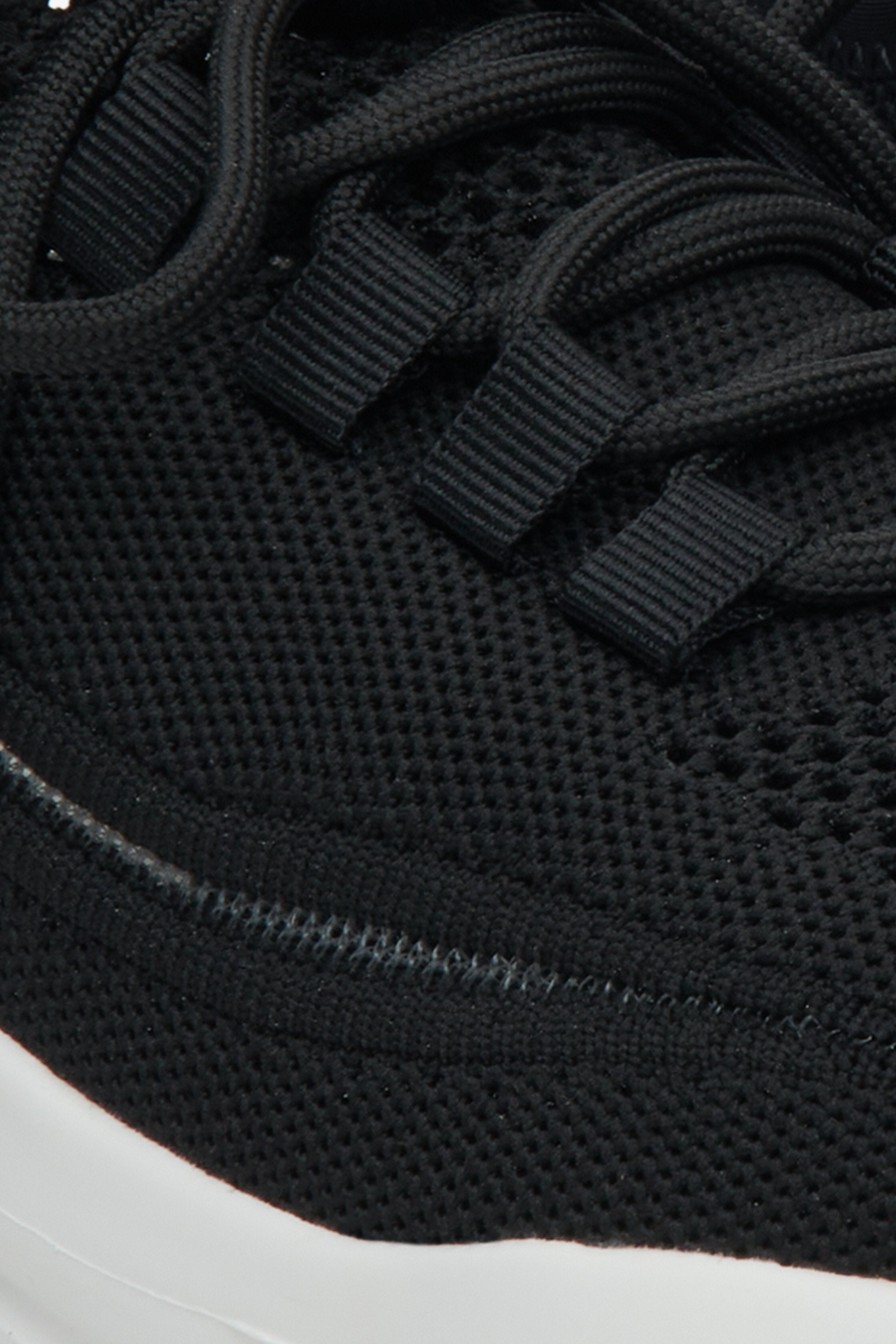 Women's black mesh and textile sneakers - a close-up on details.