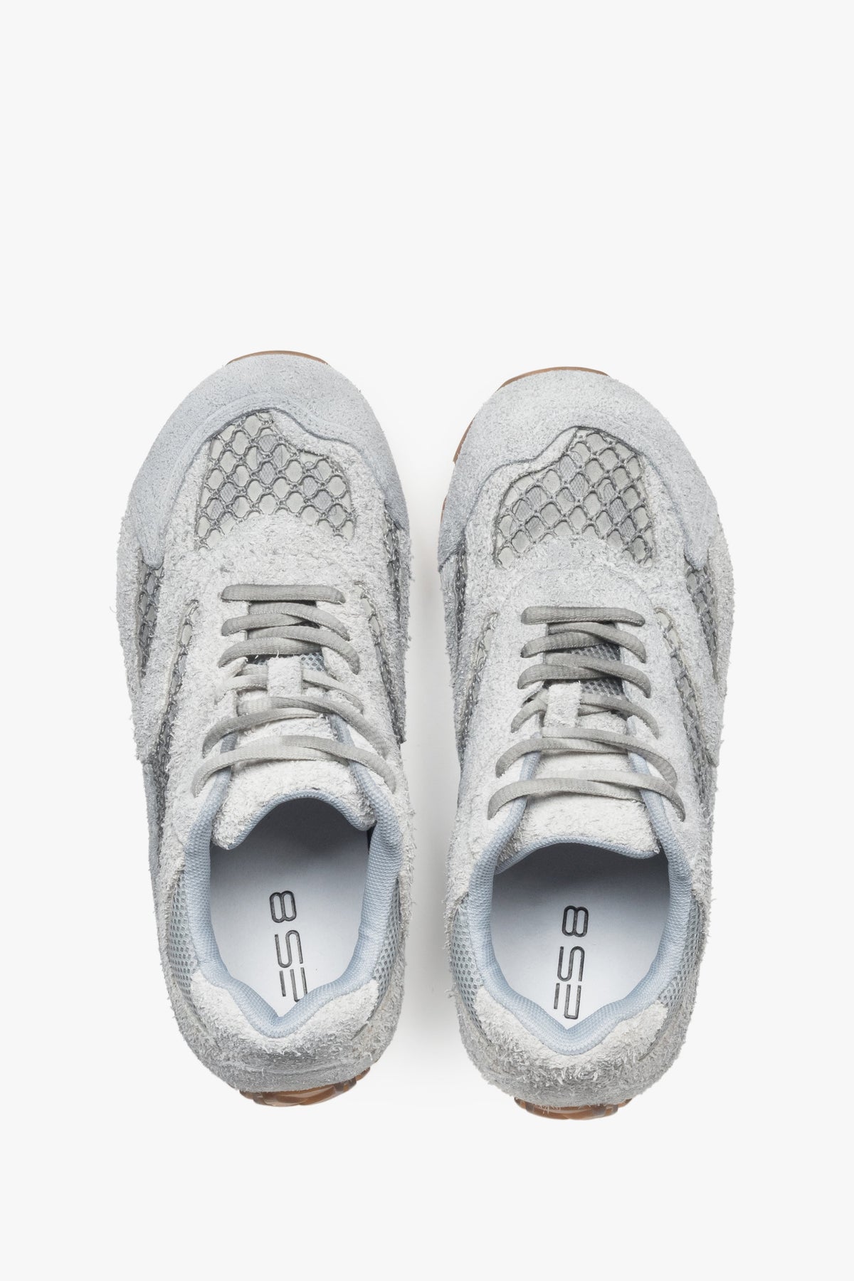 A pair of women's sneakers in grey, constructed from velour and textile fabric, model ES8.