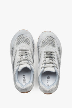 A pair of women's sneakers in grey, constructed from velour and textile fabric, model ES8.