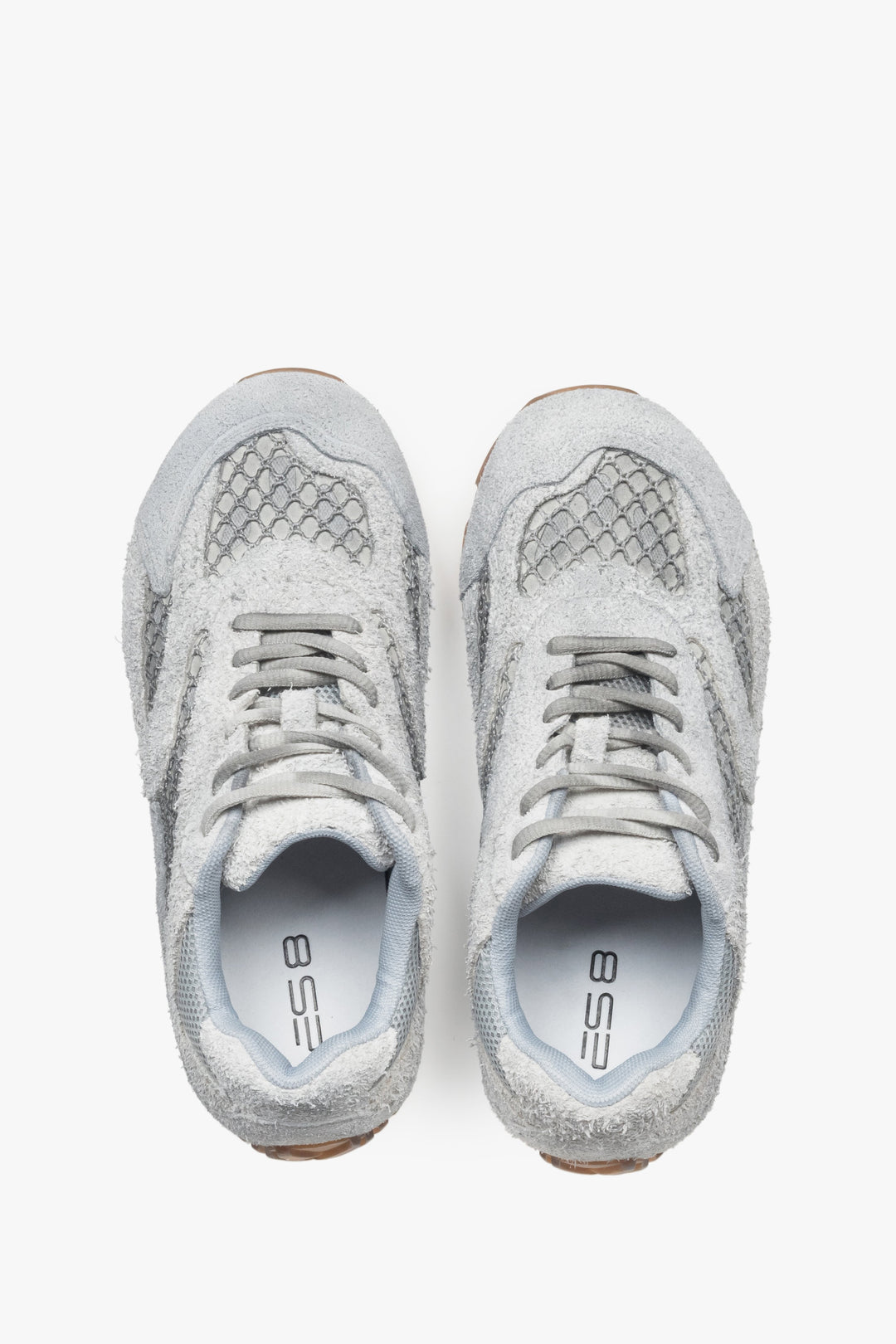 A pair of women's sneakers in grey, constructed from velour and textile fabric, model ES8.
