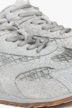 Women's grey low-top sneakers crafted from a blend of velour and textile materials.