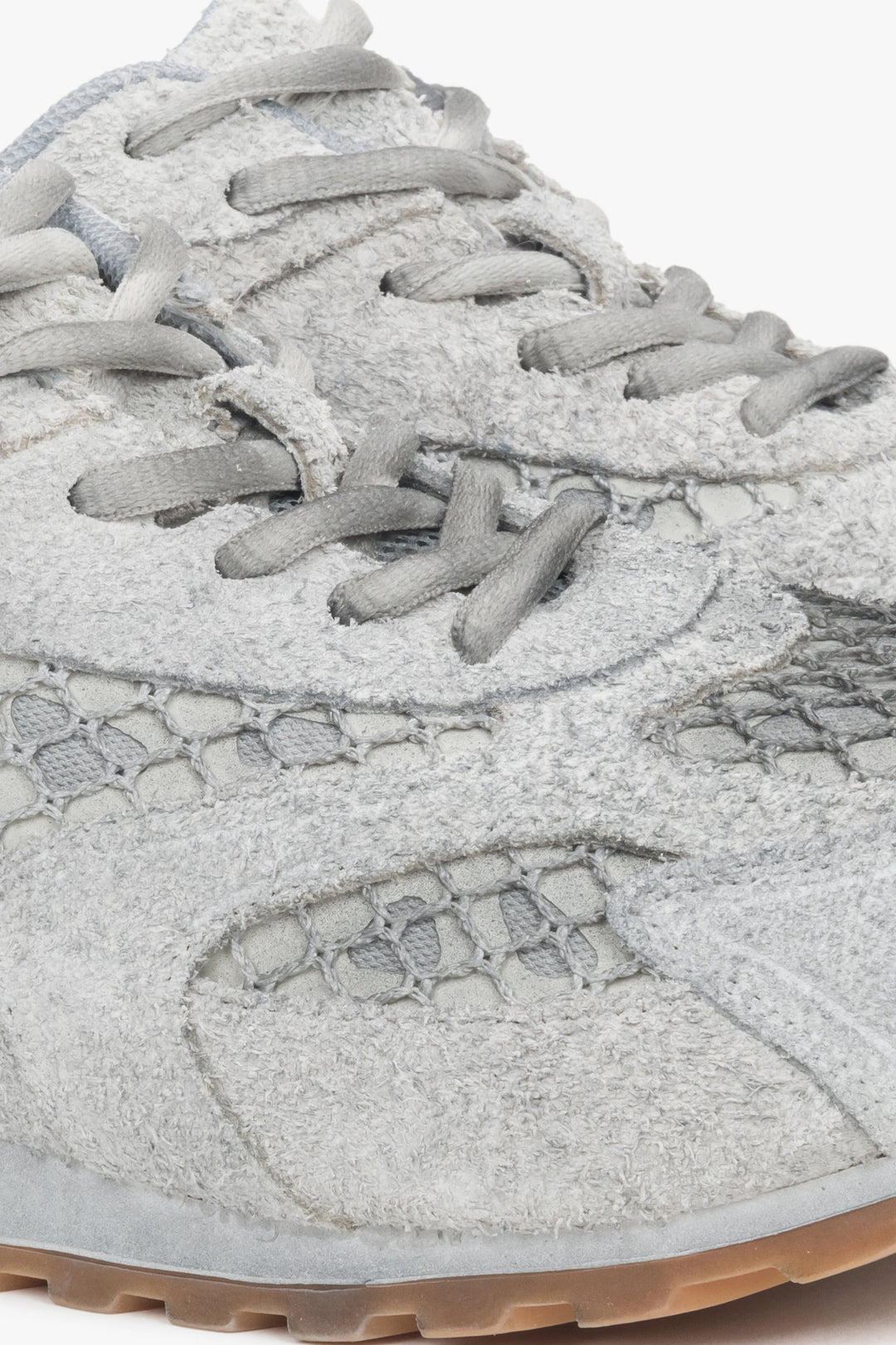 Women's grey low-top sneakers crafted from a blend of velour and textile materials.