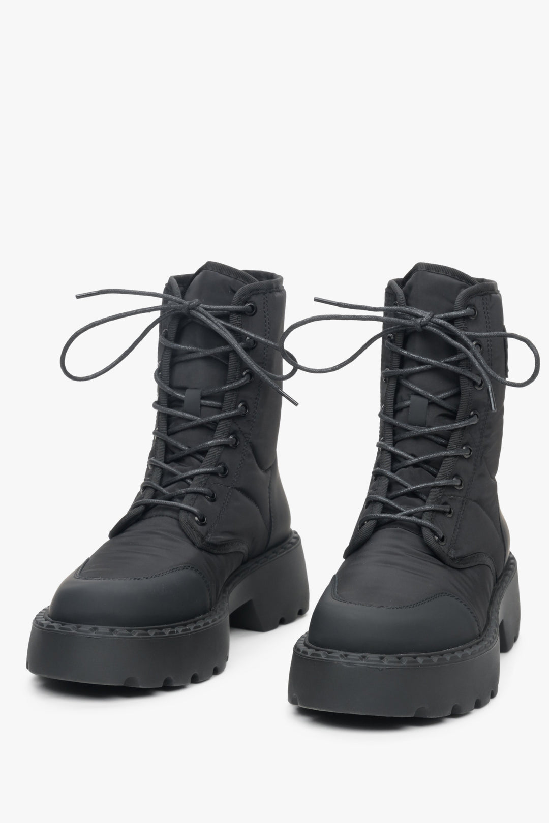 Tall black Estro women's lace-up boots.