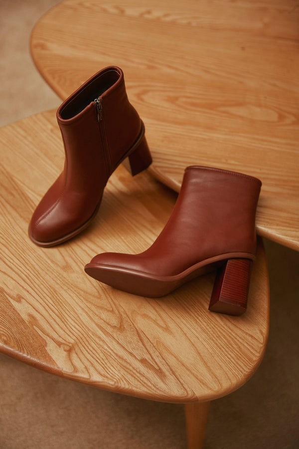 Women's brown leather ankle boots by Estro - footwear presentation.