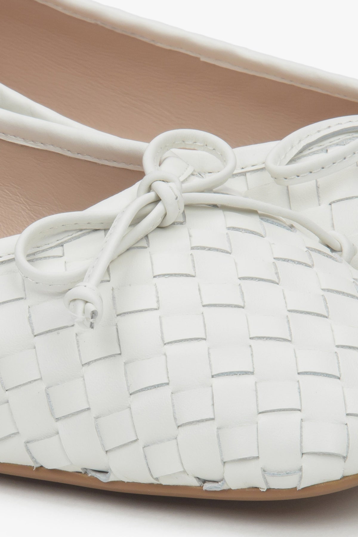 White women's ballet flats made of woven genuine leather by Estro.