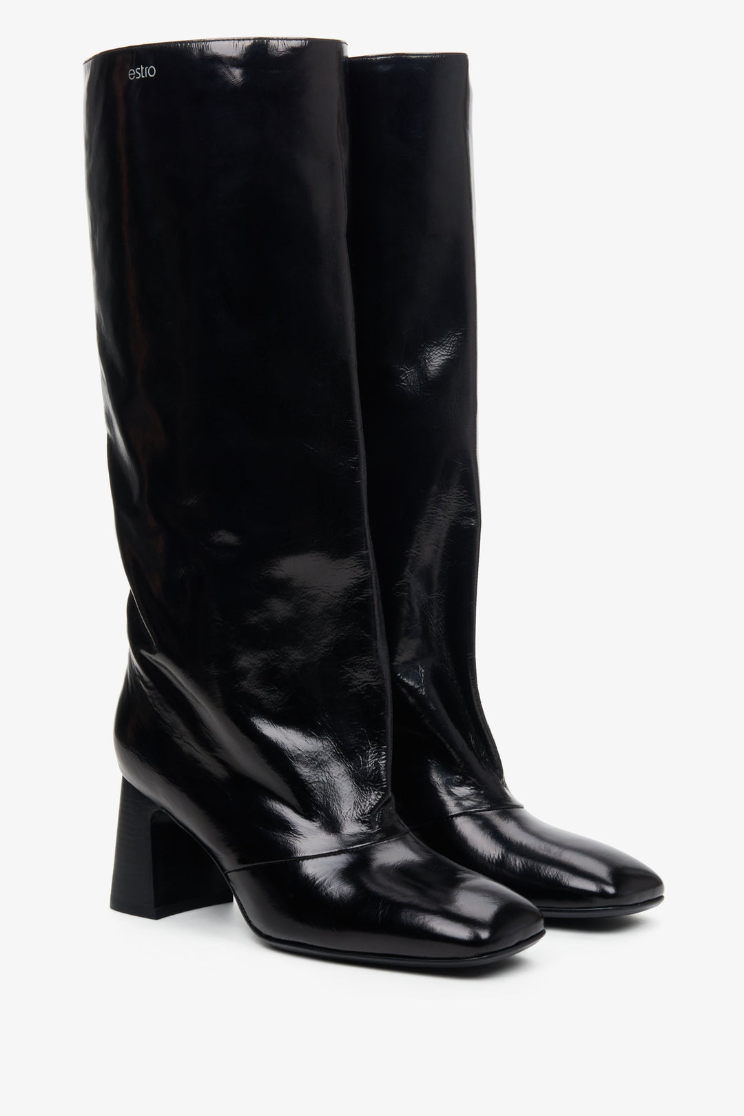 Women's black patent leather high boots with overdimensioned shaft.