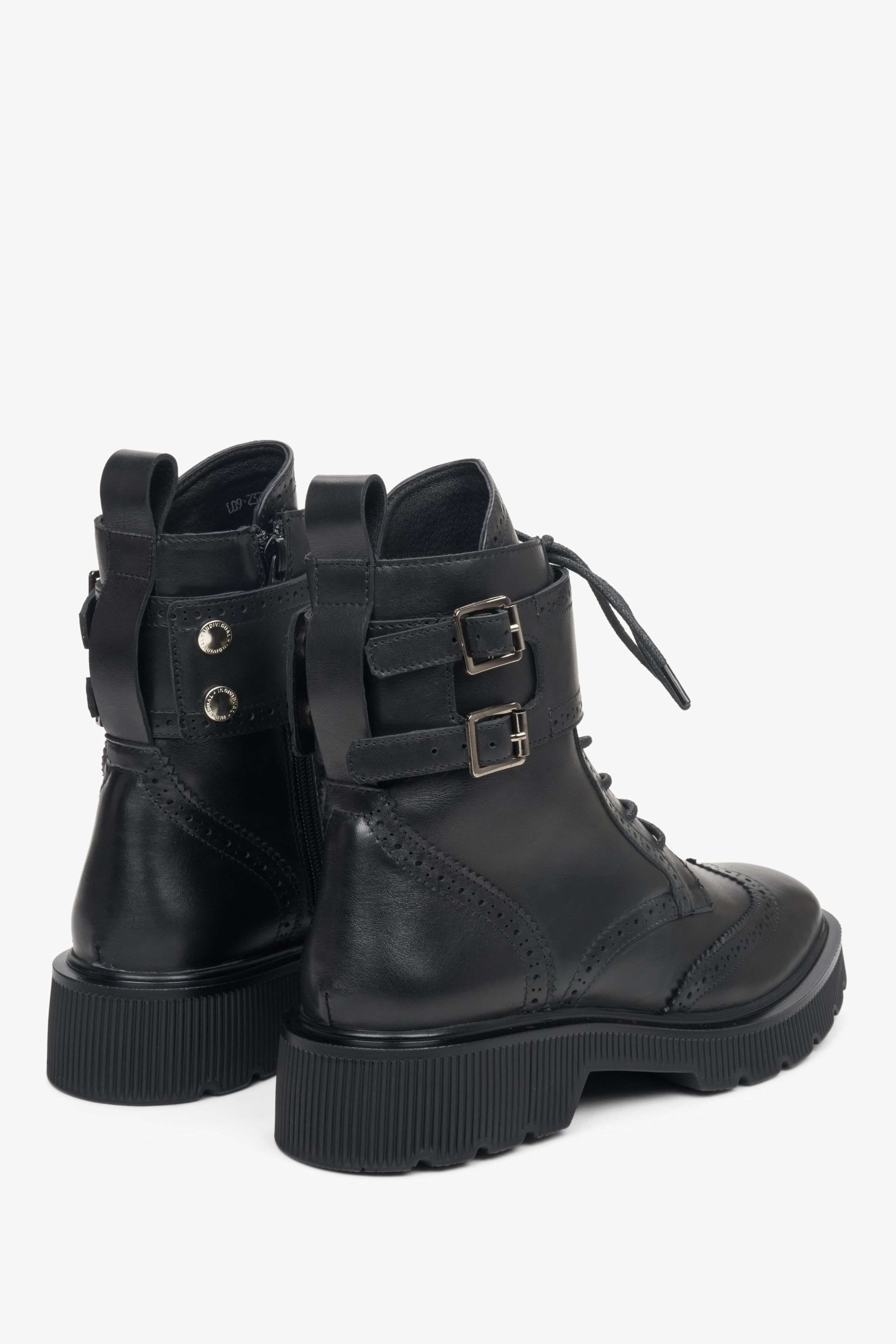 Women's black leather ankle boots Estro - close-up on a shoeline.