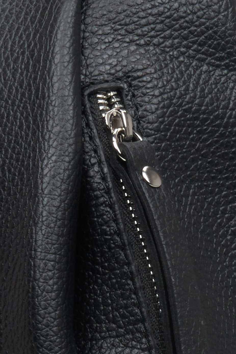 Elegant women's black backpack - close-up on details.