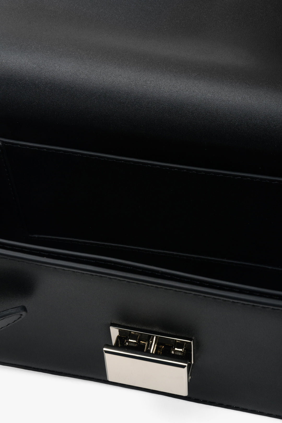 Women's handbag in black genuine leather - close-up on details.