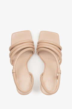 Heeled women's strappy sandals made of genuine leather in beige by Estro.