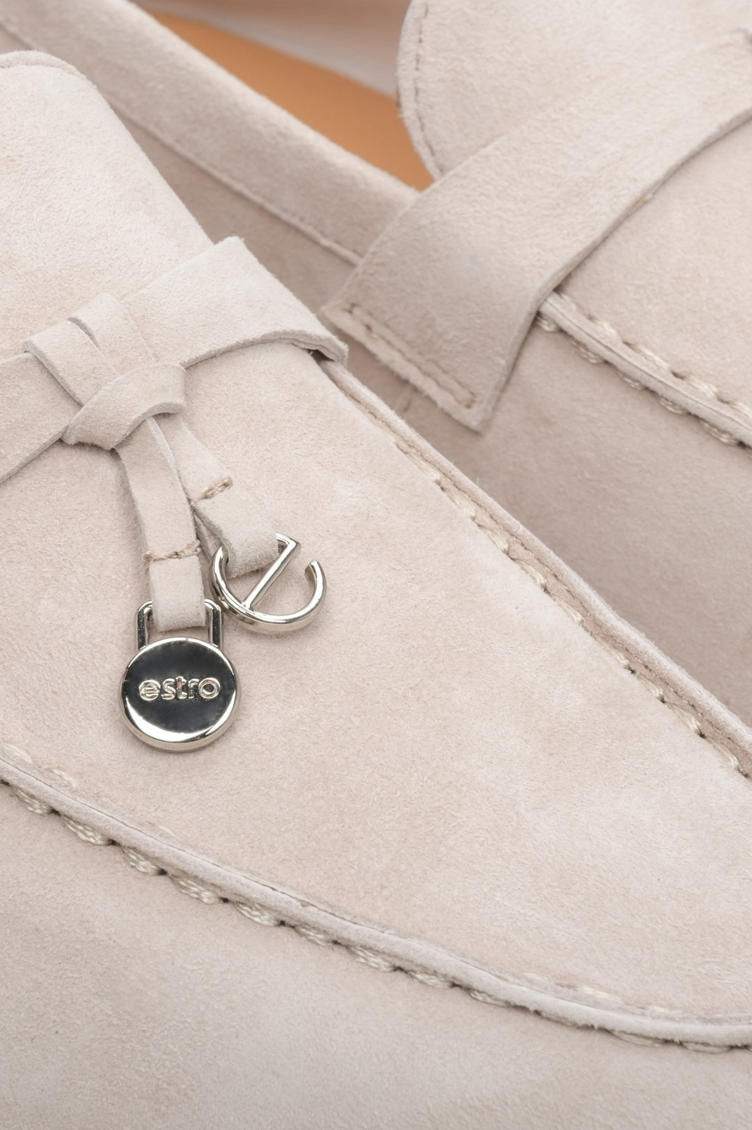Light beige comfy and elegant women's velour loafers - close-up on details.