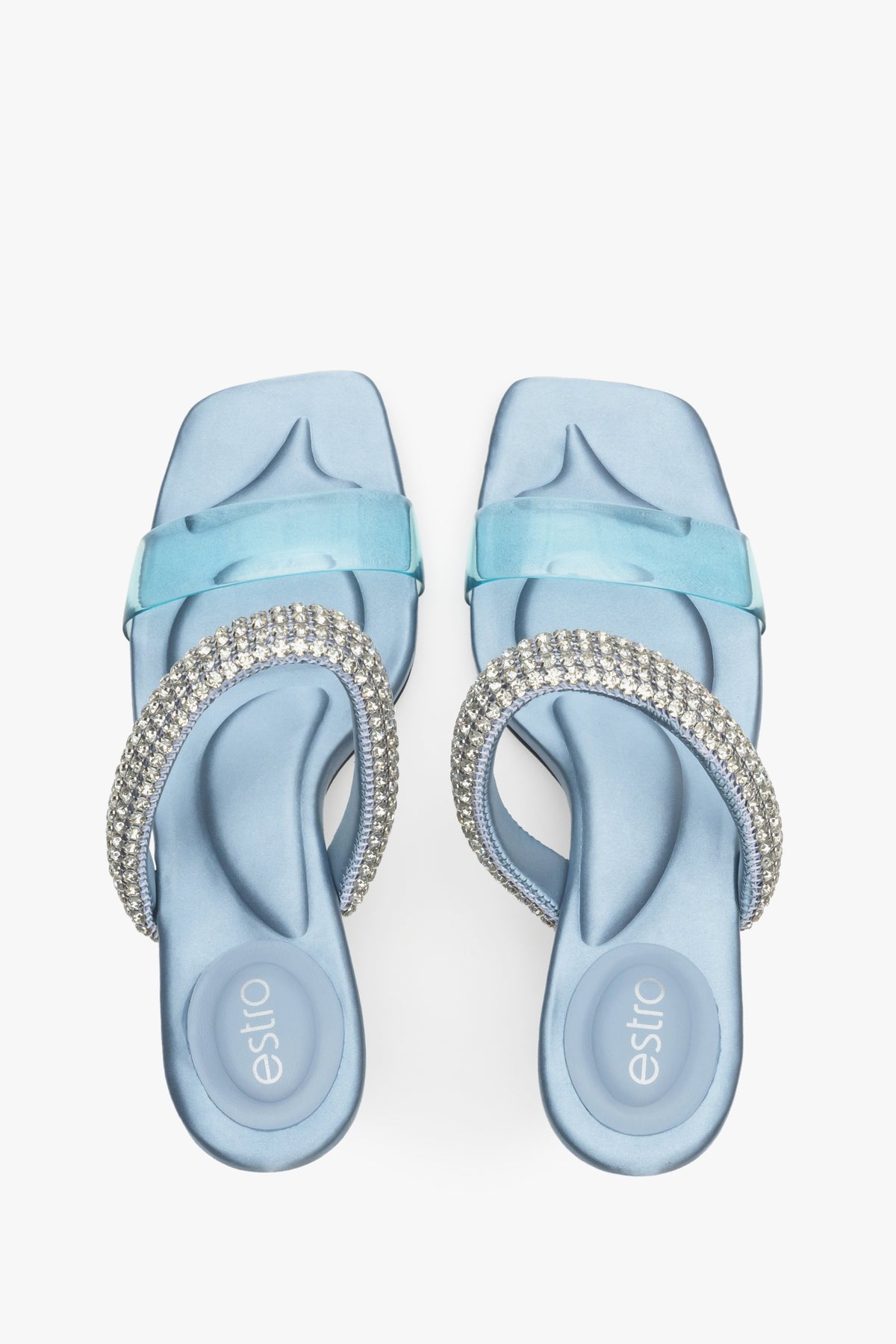 Women's elegant heeled blue mules with ornament.