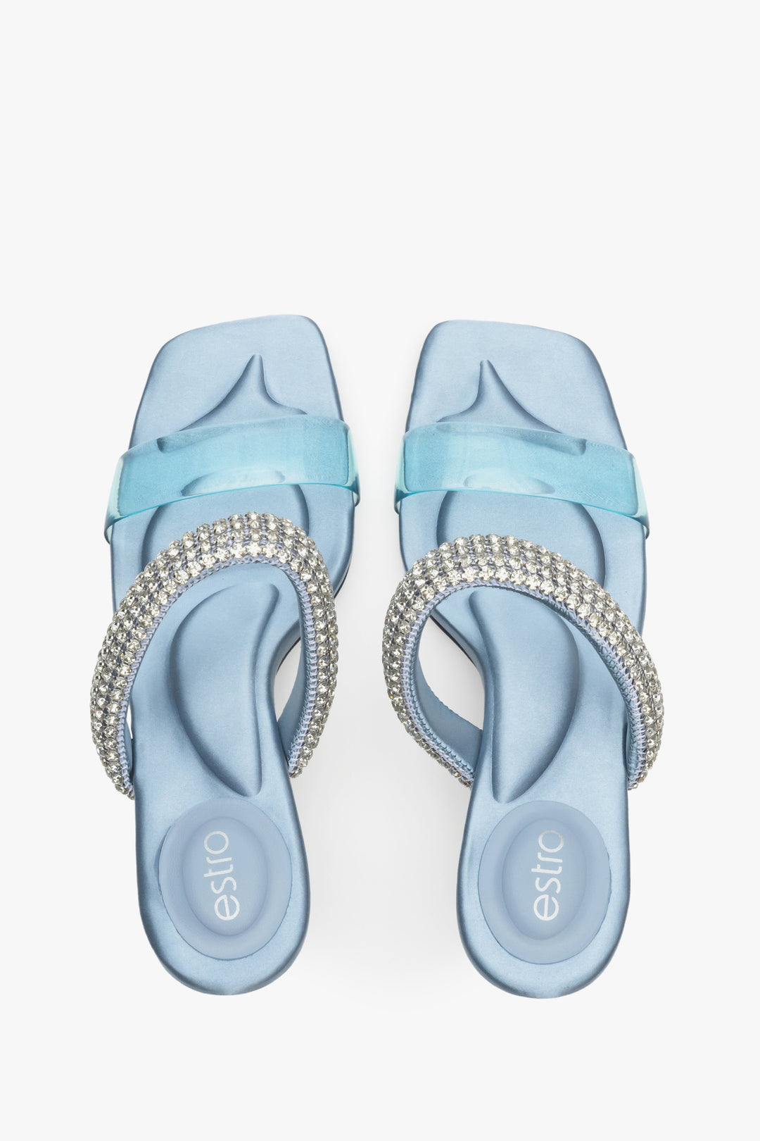 Women's elegant heeled blue mules with ornament.