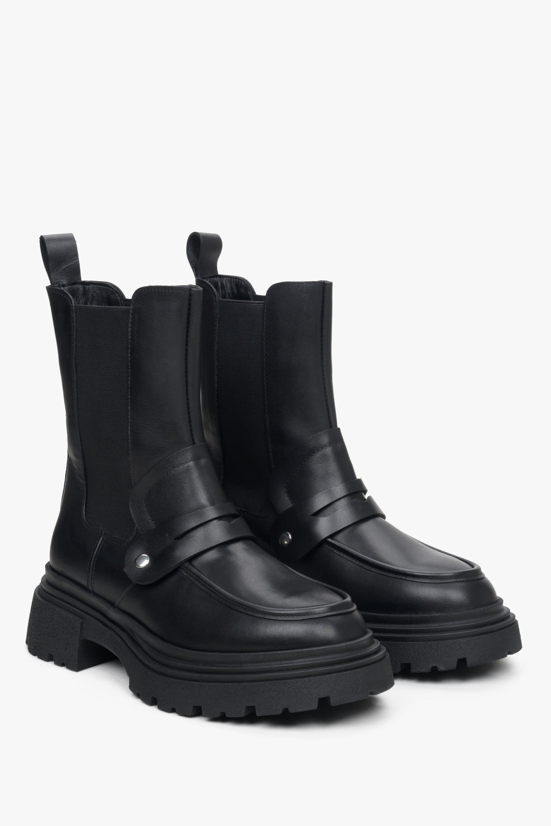 Women's black leather Chelsea boots with ornament.