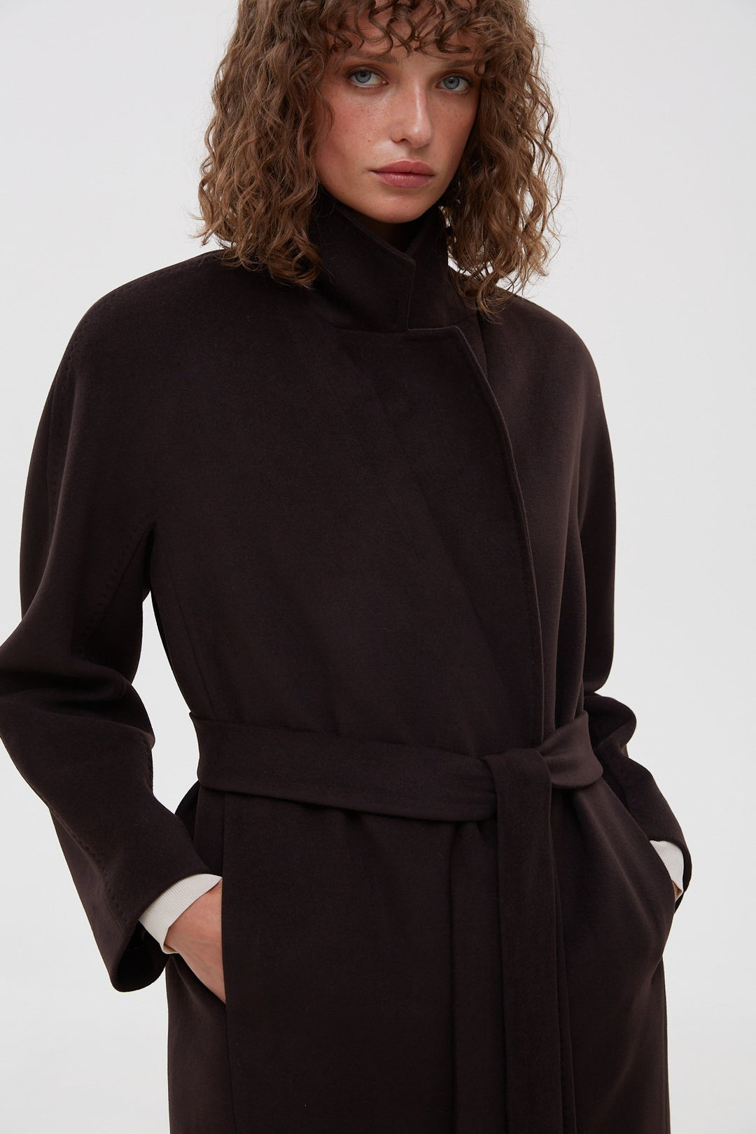 Women's black bucket coat by Estro - close-up of the front of the model.