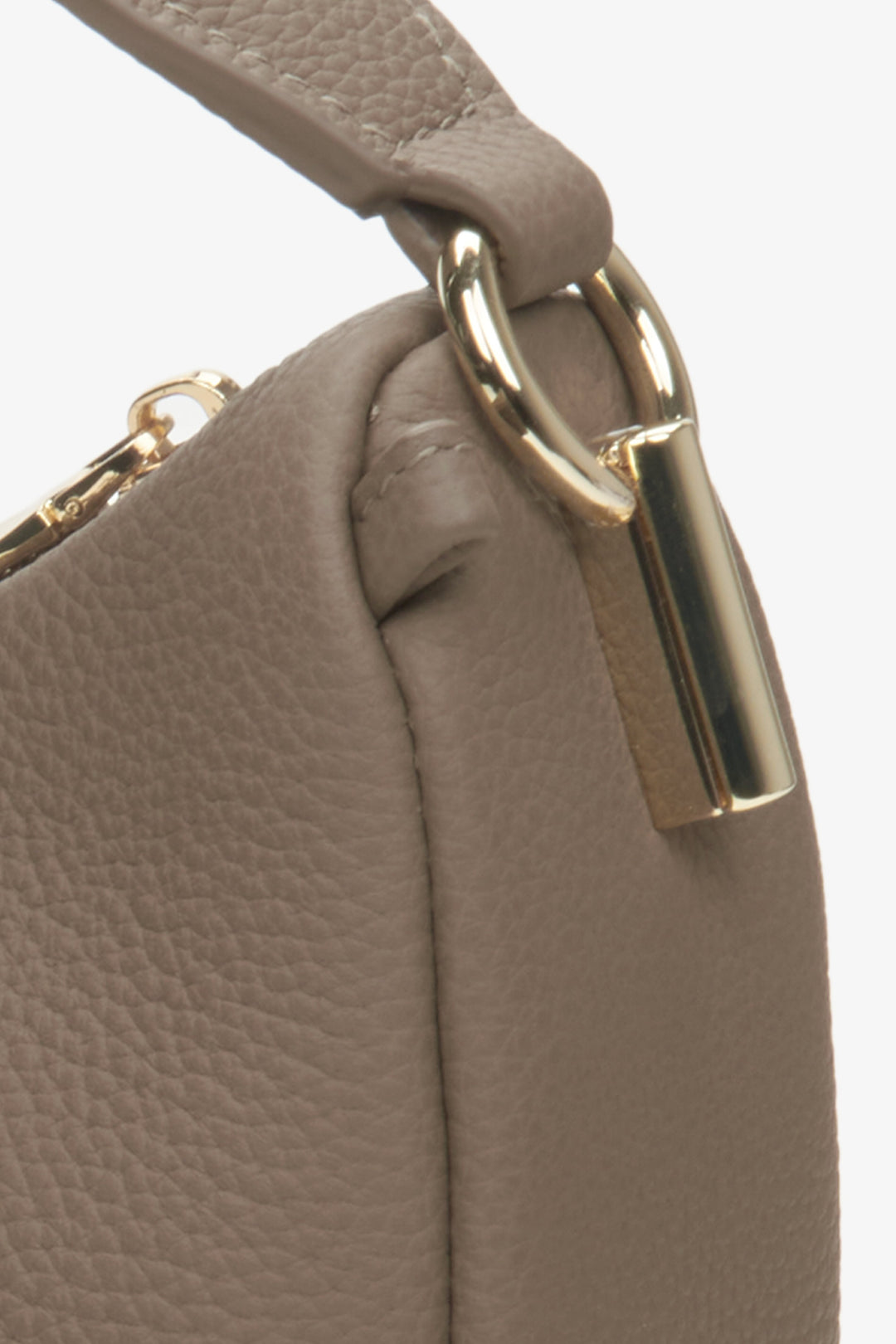 Close-up of the details of the brown crescent-shaped women's handbag by Estro.