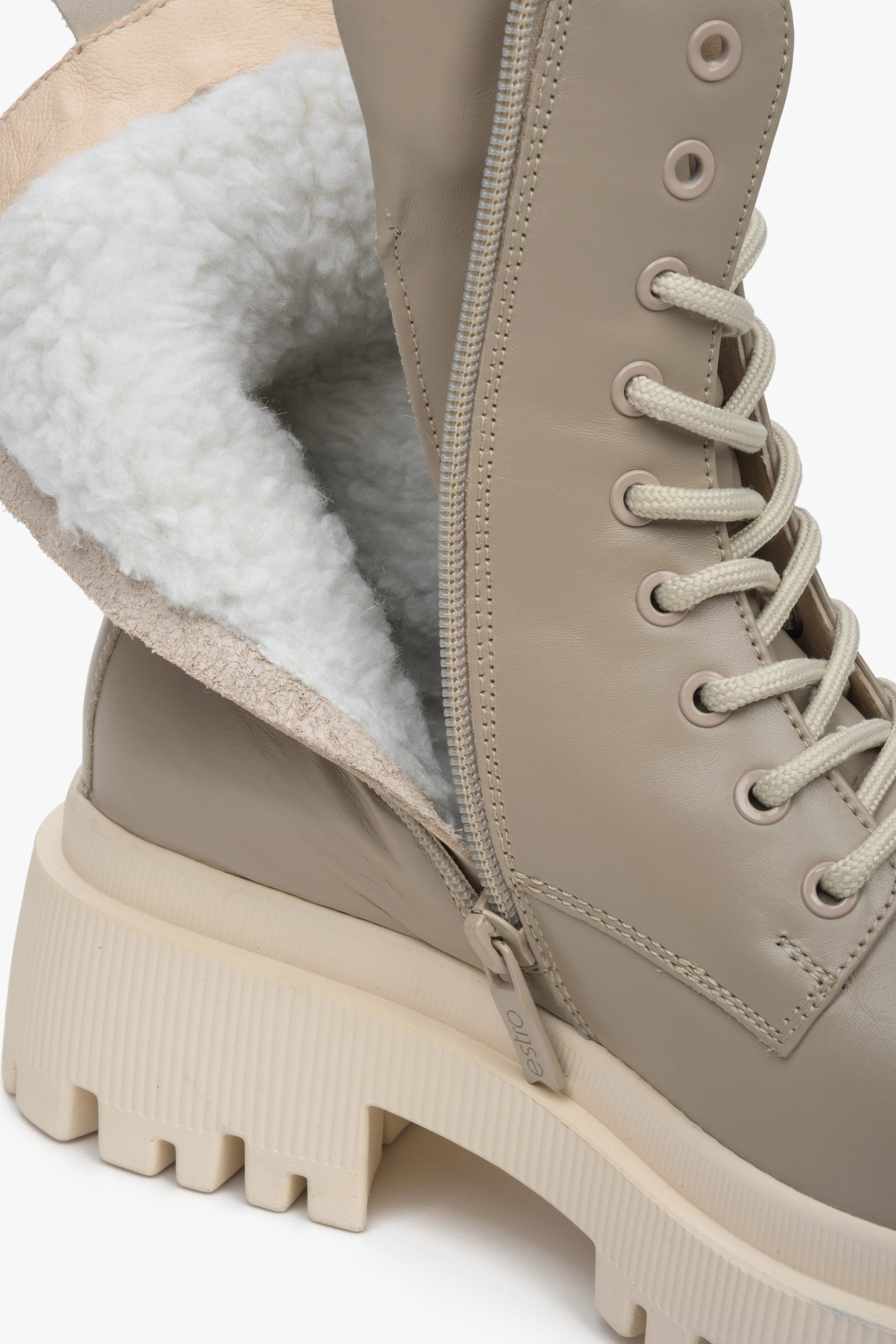 Women's beige winter boots made of genuine leather with laces and a zipper by Estro - close-up on the shoe lining.