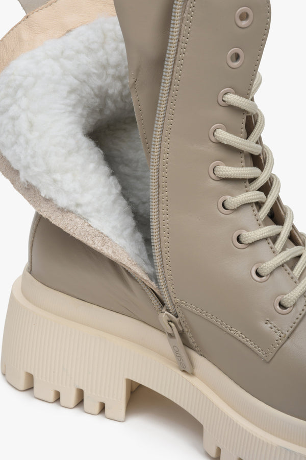 Women's beige winter boots made of genuine leather with laces and a zipper by Estro - close-up on the shoe lining.