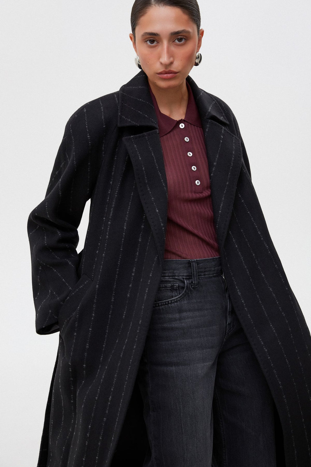 Women's black pinstripe coat.