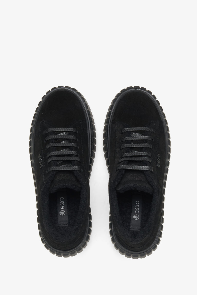 Women's black leather low-top sneakers with sealing.