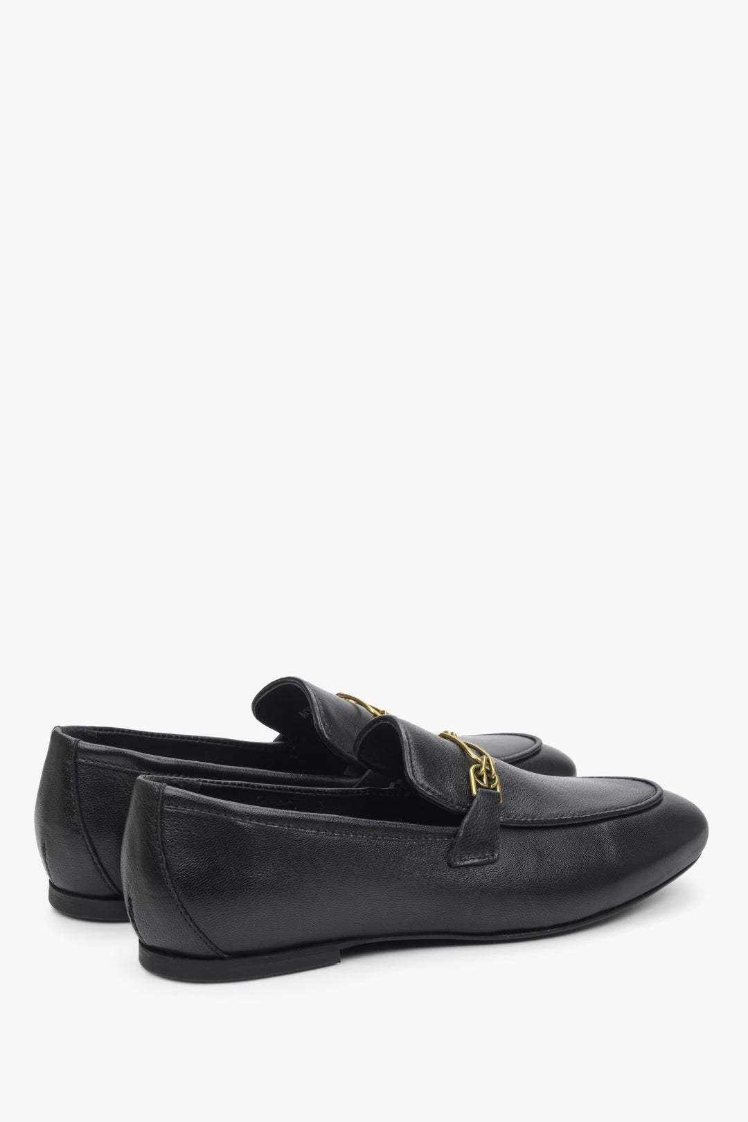 Women's black loafers Estro - a close-up on heel coubter and shoe's sideline