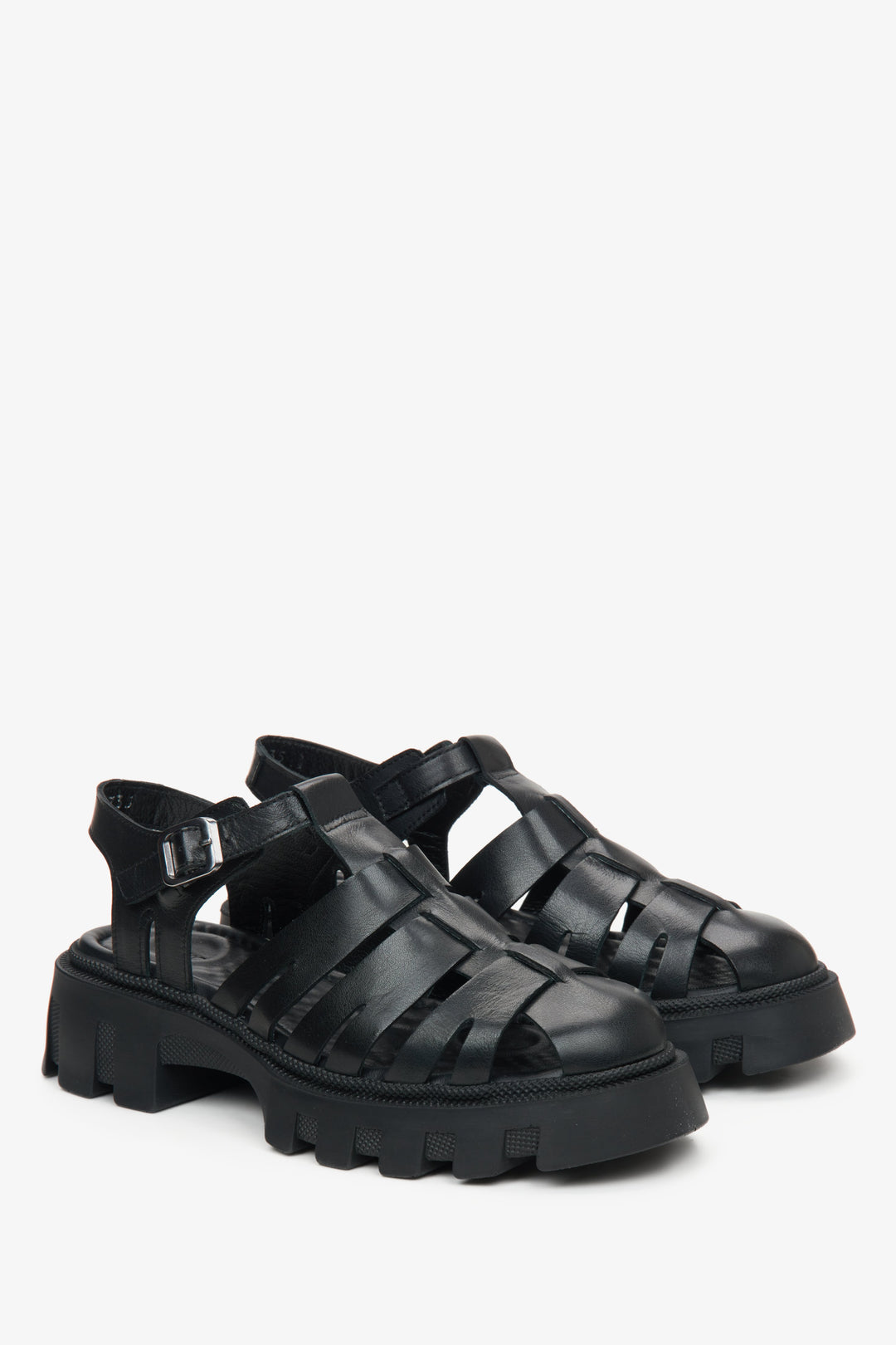 Black leather platform sandals by Estro.