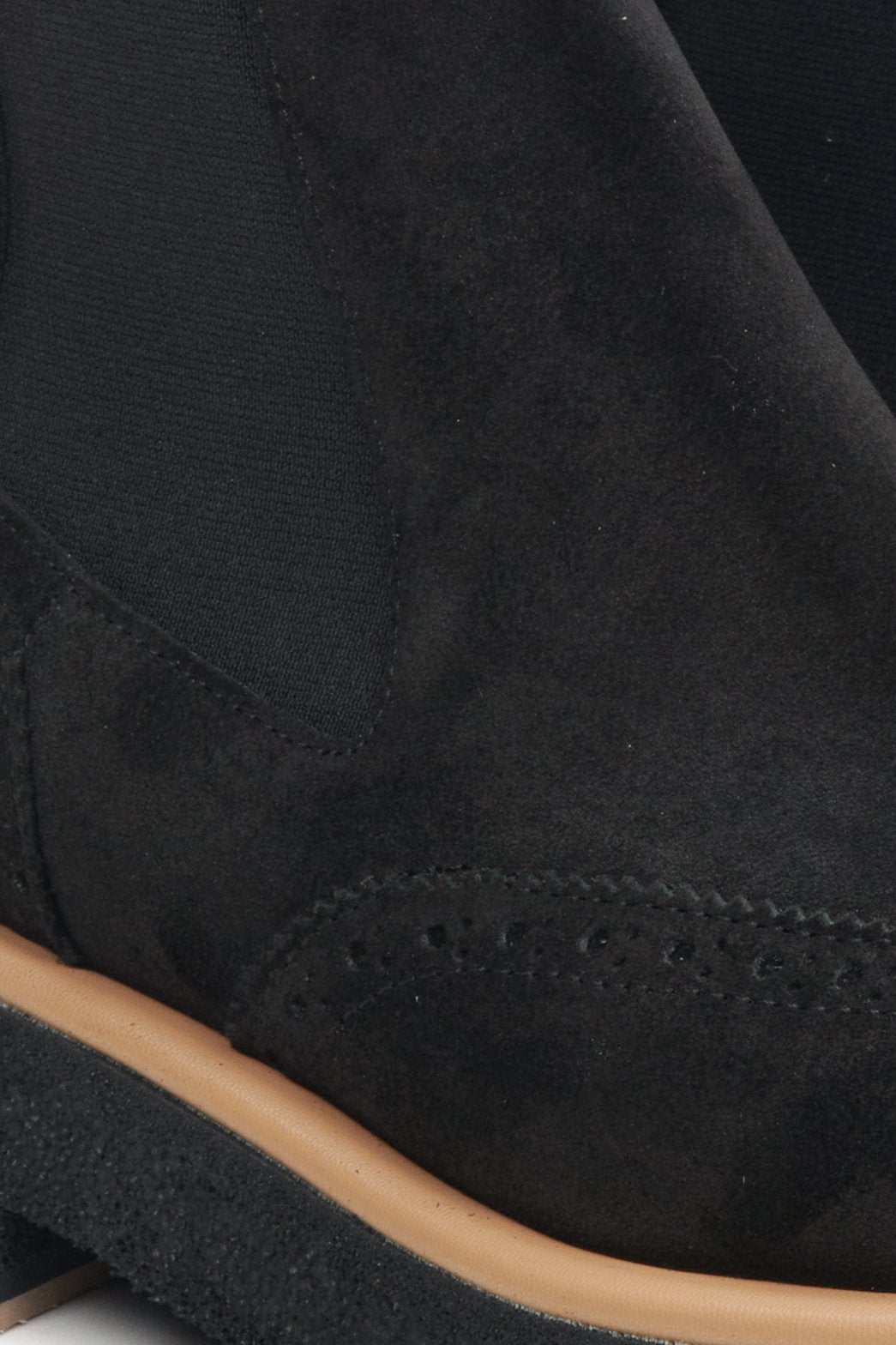 Women's black suede ankle boots by Estro - close-up on the details.