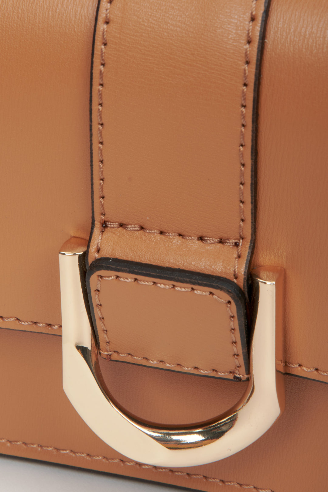 Brown leather women's handbag - a close-up on details.