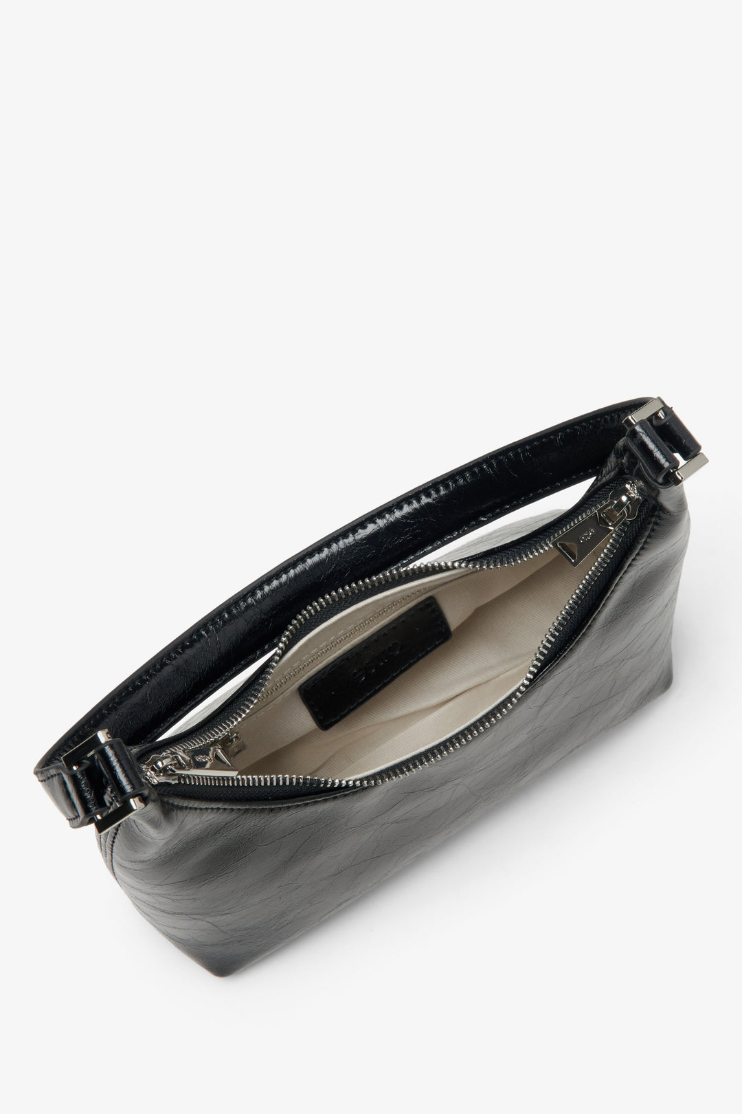 Eclectic women's black patent leather handbag - a close-up on the main compartment.