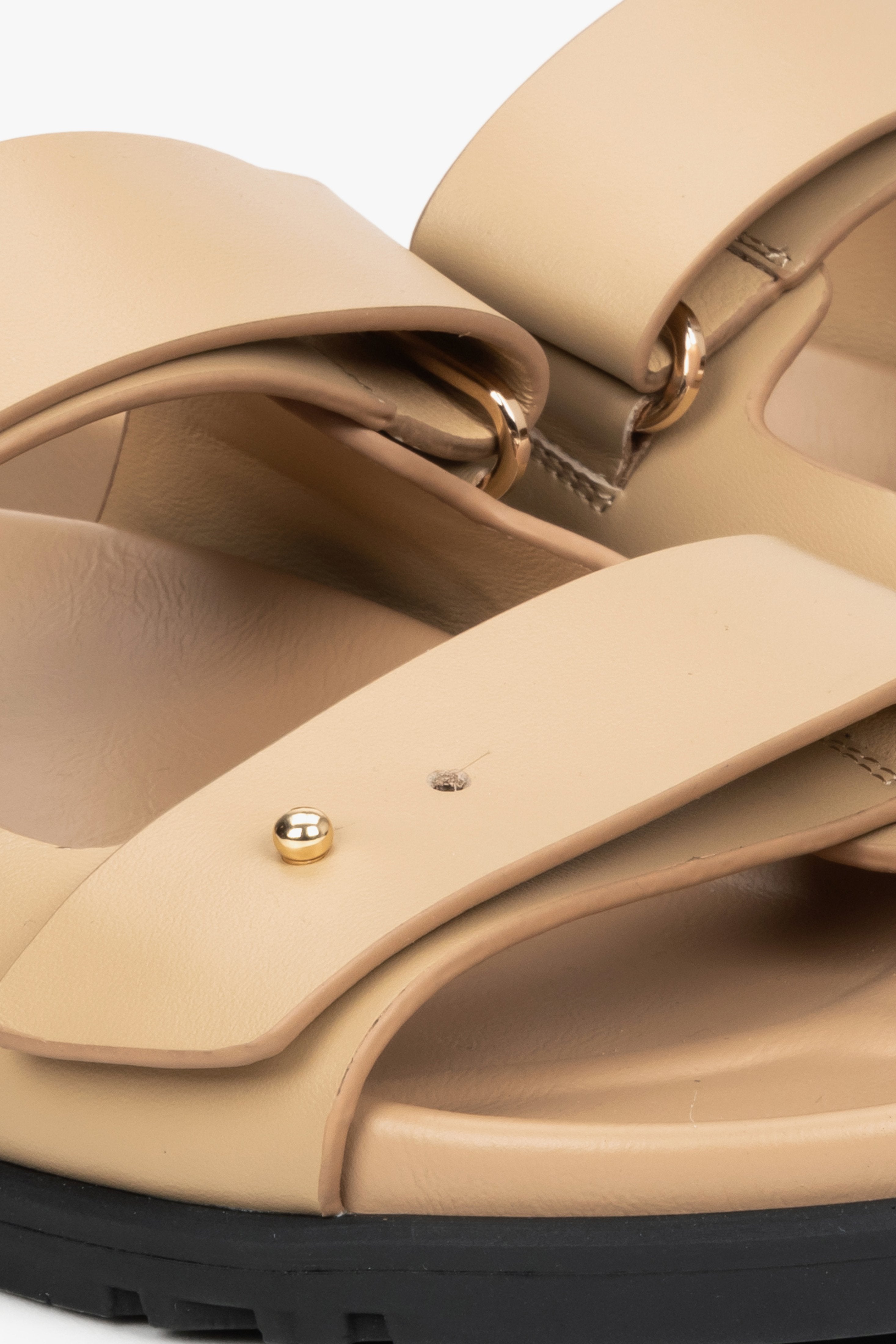 Women's beige leather slides by Estro - close-up on details.