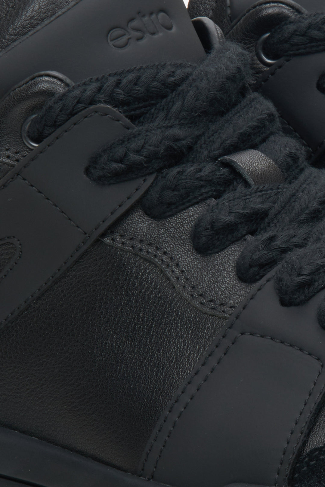 Men's black high-top sneakers by Estro - close-up on details.