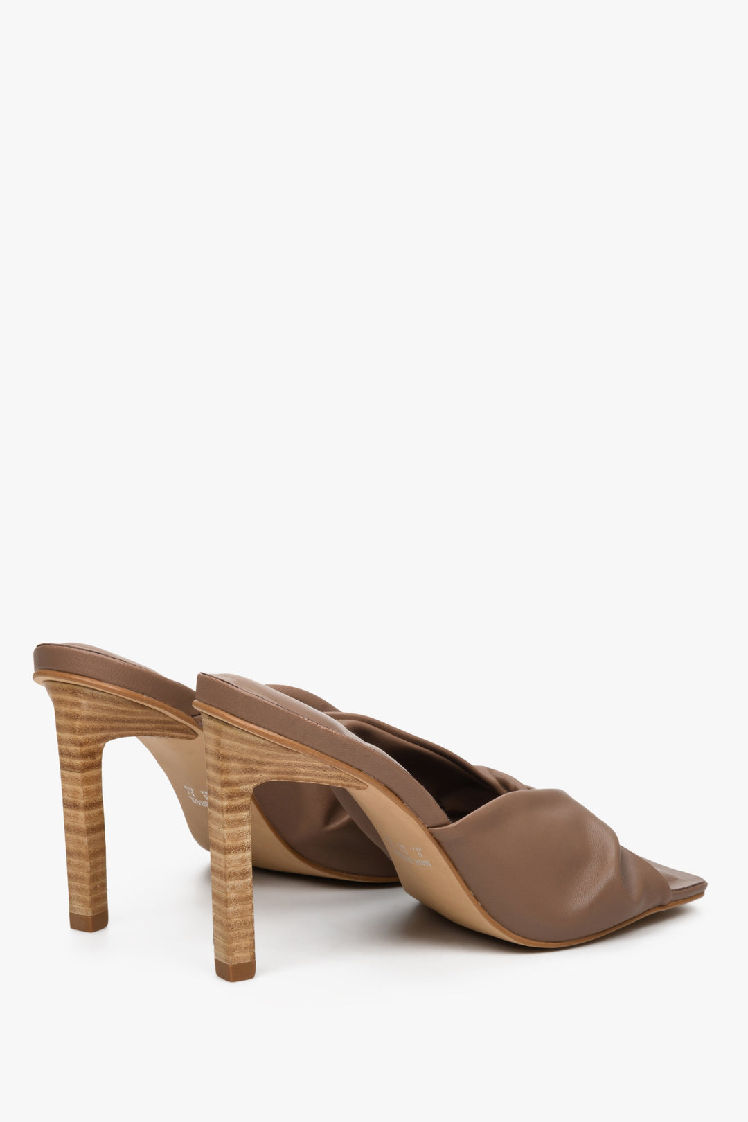 Women's brown leather high heel mules by Estro - close-up on the back of the shoes and the heel.